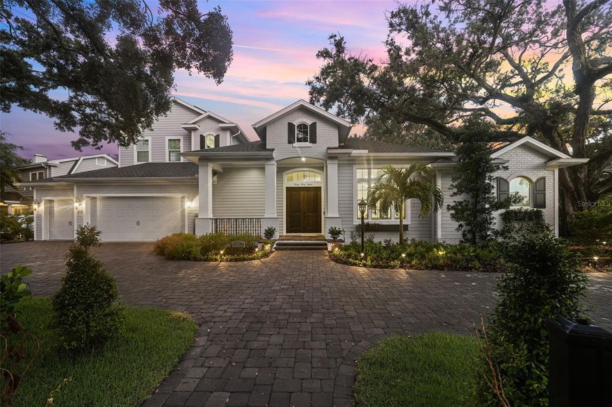 Perfectly positioned on almost half an acre lot in the heart of the prestigious Golfview neighborhood awaits your new home.  Built in 2022 to Miami-Dade hurricane standards, this Coastal inspired beauty is designed for true worry free living.  It features two-story BLOCK construction, IMPACT RATED windows, a whole house GENERATOR and whole house SOLAR panels.  Your peace of mind is complimented by the serenity you will feel as you walk through the double door entry.  Your eyes will be drawn across the foyer and living room to the set of three French doors leading to the back yard.  The extensive landscaping and pavered patio surround an inviting saltwater pool and spa creating your own private oasis.  If space to entertain is what you seek, look no further, this home's flow is perfect for social gatherings.  There is a large circular driveway for parking, a fabulous open floor plan for parties, covered patios around the pool for mingling and a large dining room for formal meals.  There is also an ADDITIONAL BONUS STUDIO off the primary that could be used as a game room, pool cabana or in-law suite.  Other features include two bedrooms on the first level including a spacious primary suite.  The primary has two equally large walk in closets and access to a covered patio.  The primary bathroom features two expansive vanities, a soaking tub and walk-in shower.  The kitchen features quartz counters, solid wood custom cabinetry, a walk in pantry, an expansive island and stainless steel appliances.  Off the kitchen is a large mudroom and laundry.  The 3 car garage features additional space for storage and an EV charger.  Upstairs, find two more bedrooms and baths both with walk in closets.  There is also a bonus room that leads to a great covered patio.  Other features include high ceilings, crown moulding throughout, an abundance of natural light, plantation shutters, home automation/security system with 7 exterior surveillance cameras, and an elevator-ready closet space on both floors.  Zoned for ROOSEVELT, COLMEAN and PLANT and close to shops, restaurants, downtown and Tampa International, this home offers so much!  The only thing missing is you!  Schedule your showing today!