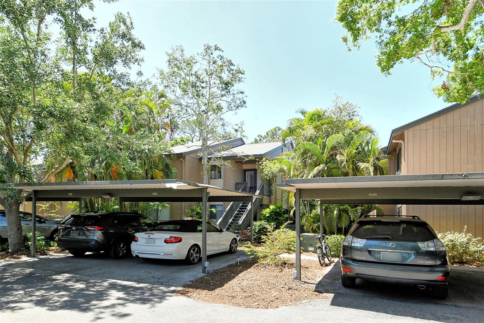 Well maintained and tastefully furnished 2nd floor end unit. Brazilian mahogany floors throughout as well as a newer heating/cooling system and a 3-year old hot water tank. A touch of elegance is added by the glass front entry door which contributes generously to the amount of daylight entering this part of the unit. There are quartz countertops throughout. Adding to the convenience are cabinets with self-closing drawers and doors. The appeal of the unit is further enhanced by a 1 year old sofa and loveseat. The walk-in closet has been outfitted with shelving and affords ample storage space. Adjoining the closet is a fully tiled bathroom sporting a brand-new faucet. This unit is designed to satisfy your needs for the foreseeable future. Pelican Cove is a gated pet friendly condominium community abounding with amenities, including a low-cost 86-slip boat harbor, kayak and canoe launch, six heated swimming pools, hot-tub, three clubhouses, classrooms, gym, art, woodworking and pottery studios, four lit tennis/pickleball courts, shuffleboard, basketball, dog play area, walking trails, boardwalks and fishing gazebos. Take classes at Pelican Cove University, yoga, tai-chi, water aerobics, painting or photography. More than 37 clubs for arts, cycling, culinary arts, bridge, film and more. Relax at the evening jazz & classical music concerts, enjoy a stroll around 78 acres of lush grounds. Pelican Cove is hidden away yet minutes from everything! Come see for yourself! This is the lifestyle you deserve!