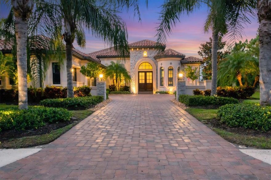 Under contract, BACKUP OFFERS WELCOME. Welcome to your dream home in The Lake Club at Lakewood Ranch, designed by the esteemed Arthur Rutenberg. This stunning residence seamlessly blends luxury and functionality, offering an exquisite living experience in one of Florida's most sought-after communities.  As you approach the oversized three-car garage home, you're greeted by an elegant facade that showcases meticulous craftsmanship and attention to detail. Upon entering, the expansive open floor plan invites you into a bright, airy living space filled with natural light. The grand foyer leads to a spacious great room, where soaring ceilings and large impact windows provide breathtaking views of the private preserve and a view of the lake if you want it. The chef's kitchen is a culinary delight, featuring top-of-the-line appliances, custom cabinetry, and a generous island perfect for casual dining and entertaining. The kitchen and dinette area flow seamlessly into the outdoor living space, creating an ideal setting for gatherings with family and friends. As you roam through this spacious home you’ll notice the endless upgrades the owner has added including numerous stone facades, dual crown molding, electric fireplace, wood flooring, sauna, and much more. Step outside to the massive lanai, a true oasis where indoor and outdoor living converge. This spacious area is ideal for entertaining, complete with a dedicated lounge space, fireplace, dining area, and an outdoor kitchen, perfect for hosting barbecues or enjoying alfresco dinners under the stars. The centerpiece of the lanai is the luxurious saltwater pool and spa overlooking the preserve, designed for relaxation and enjoyment. There is also a separate therapeutic spa perfect for relaxing after a round of golf.  Surrounded by elegant pavers and lush tropical lighted landscaping, this private retreat invites you to unwind while basking in the Florida sunshine or taking a refreshing dip in the sparkling waters. The home features three well-appointed guest bedrooms, and an opulent primary suite with a spa-like ensuite bath and two walk-in closets. Each guest room is designed for comfort, providing privacy and tranquility for family and friends.  Enjoy the comforts of a whole-home generator if you ever lose power and a whole-house reverse osmosis water system. Located in The Lake Club, residents enjoy exclusive access to world-class amenities, including a clubhouse, fitness center, tennis and pickleball courts, and scenic walking trails. The vibrant community atmosphere, coupled with beautifully designed landscapes, makes this the perfect place to call home.  Enjoy access to the Lakewood Ranch Country Club with varying types of membership that include access to four golf courses, tennis pickleball, a modern fitness center, and unlimited social activities. Experience luxurious living in this exceptional Arthur Rutenberg custom home, where every detail has been thoughtfully considered to provide an unparalleled lifestyle in the heart of Lakewood Ranch. Don’t miss the opportunity to own this exquisite property that truly exemplifies the best of Florida living.