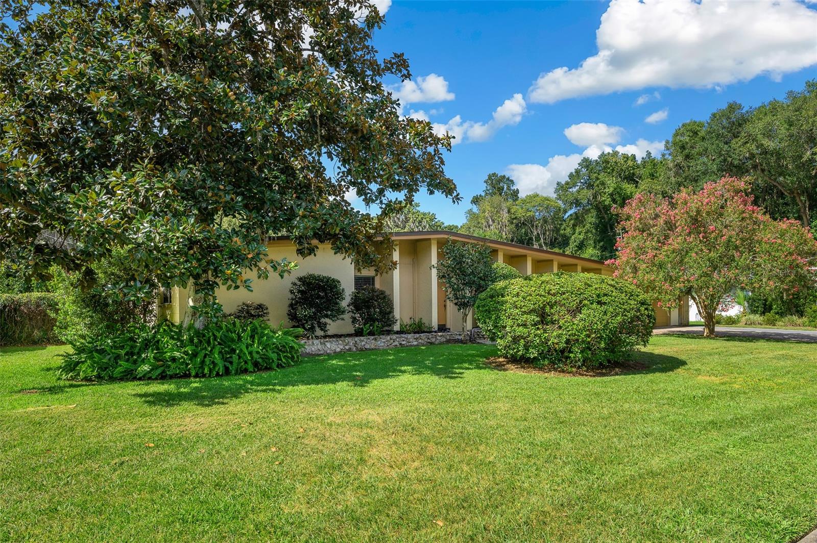 Welcome home to this fantastic concrete block and stucco 4-bedroom pool home in Gainesville's sought-after Forest Ridge neighborhood. Sited on a beautiful 1/3-acre lot in the back of the neighborhood, this home provides a perfect oasis only two miles from UF, and provides easy access to Shands Hospital as well as nearby shopping and restaurants. Interior features include a sunken living room, dining room, and a large sunny kitchen that opens to the family room with fireplace. French doors off the family room open to a screened room with views of the large pool and beautiful gazebo with summer kitchen! Enjoy peace of mind with a new HVAC (2024), re-pipe (2023), along with other updates. There is a large air conditioned laundry/utility/storage room adjacent to the kitchen that is not included in the heated/cooled square footage. This home is near a small neighborhood park and a nature trail that leads to Alfred Ring Park, a gorgeous 21-acre city park with trails and beautiful views of Gainesville's Hogtown Creek.