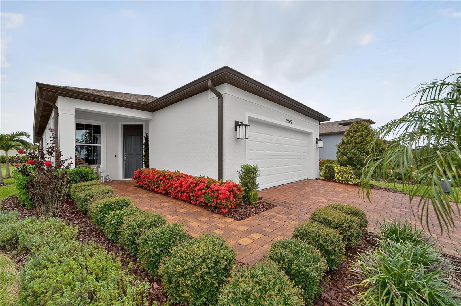 Enjoy living in an active adult 55+ community where a full time activities director and social calendar make life FUN! This gorgeous home built in 2021 is waiting for you! Enjoy maintenance-free living in this 1405 square foot home in the desirable Del Webb Bexley community. This tranquil upgraded residence features two bedrooms, two bathrooms and a flex room with doors that may be used as a third bedroom. Two car garage. Luxury vinyl plank flooring in the main areas and upgraded carpet in the two bedrooms, upgraded kitchen cabinets and stainless appliances along with a breakfast island create an inviting space for you, your family and your guests. You will LOVE cooking with GAS! Outdoors there is a screen enclosed patio overlooking your private backyard. Only one small dog allowed under 10 pounds and no indoor smoking. A resort style pool, resistance walking pool, hot tub, clubhouse with fitness center and cafe', pickleball and tennis courts & vegetable garden await! Clubs galore to choose from! Conveniently located near the Tampa premium outlet mall, extended shopping, medical facilities and short commute to TIA. Lawn care included! One resident from each home MUST BE 55 years of age or older! Anyone OVER 22 may reside with their family.