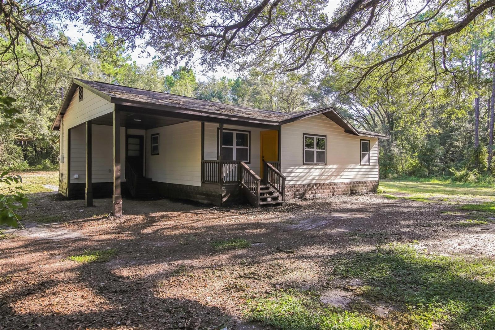 Welcome to this beautifully remodeled home tucked away at the end of a quiet street in Morriston, backing up to the serene Goethe State Forest. Every detail has been updated for peace of mind and modern comfort, including a new roof (2025), new HVAC system (2025), new water heater, and fresh interior and exterior paint. Inside, enjoy brand-new luxury vinyl plank flooring with upgraded baseboards, a stylish kitchen featuring shaker cabinets, quartz countertops, and stainless steel appliances, plus updated hardware and fixtures throughout. The bathroom has been tastefully refreshed, offering a clean and modern feel. Outside, a magnificent sprawling oak frames the front yard, creating timeless curb appeal and shade. This move-in ready home combines the tranquility of nature with high-quality finishes—Florida living at its finest!