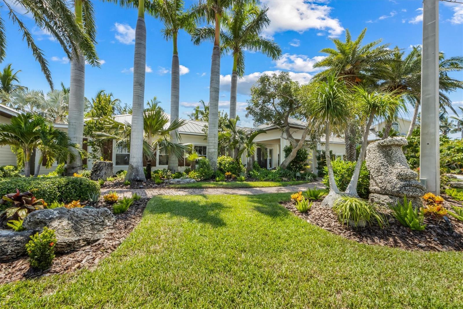 This Bayview Palace is a One of a kind, there’s nothing quite like this on Anna Maria Island!! Discover paradise in this 4 bedroom, 4 full bathrooms and 2 half baths, stunningly renovated home nestled in the heart of Anna Maria Island. Situated on two spacious lots, this exquisite property offers rare space, privacy, and direct access to the sparkling waters of Tampa Bay. Complete with TWO private 20,000 lb boat lifts, floating dock and can fit up to a 42 ft boat, and has 50 amp! The absolute ultimate boating lifestyle! This beautifully updated residence blends modern elegance with bohemian island charm. The open-concept living space dazzles with soaring ceilings, abundant natural light, high end brand name kitchen appliances and a separate bar with sub zero ice maker! The gourmet kitchen is a chef’s dream with a very spacious island perfect for gatherings, custom cabinetry and porcelain travertine floors throughout! Each of the four generously sized bedrooms boasts its own en-suite bathroom. The master suite is a serene oasis, complete with custom closets and a huge walk in shower spa-inspired bathroom. Right off the master suite is the private spa hot tub for relaxing under the stars. Outside, the expansive double lot provides endless possibilities—enjoy lush tropical landscaping, a sparkling pool, pool bath, screen in porch and tiki bar / game room. Just a short stroll to Pine Avenue’s boutique shops, restaurants, and the Gulf, this home offers the ultimate island lifestyle. Detached 3 car garage includes an upstairs storage room/ play room. Other features include a well, generator, outdoor shower and more! Don’t miss this unique opportunity to own a fully renovated masterpiece on two lots in one of Florida’s most charming coastal communities. Schedule your private tour today!