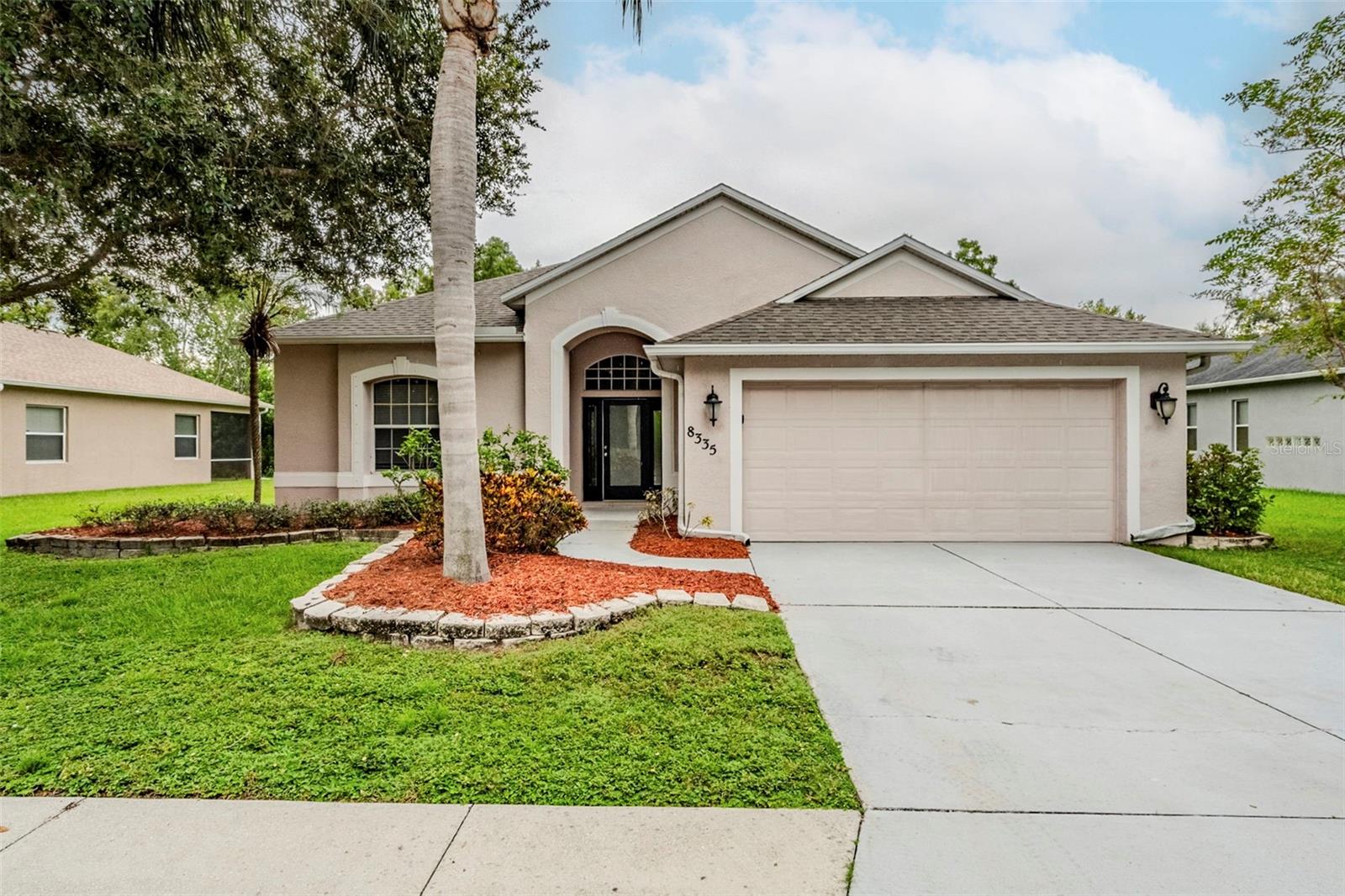 One or more photo(s) has been virtually staged. Beautiful 1-story, 3-bedroom, 2-bathroom home with a 2-car garage and welcoming foyer. The open layout features a kitchen with island bar that combines the eating area and family room, while the separate great room offers additional space for relaxing or entertaining. Enjoy the bright sun room, perfect for morning coffee or reading. The primary suite includes a double vanity, separate tub and shower, and a spacious closet. One or more photos have been virtually staged to showcase the home’s potential. Schedule a showing today!