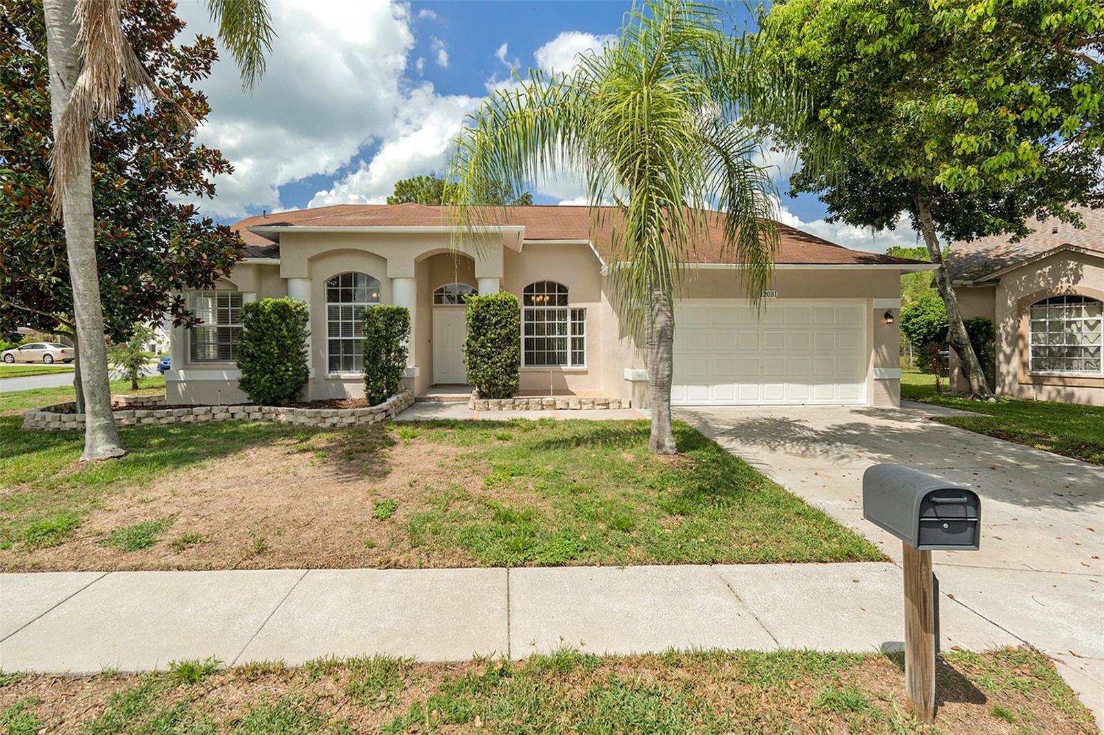 One or more photo(s) has been virtually staged. Nestled on a corner of a cul-de-sac in the highly sought-after community of River Ridge, this inviting home has great curb appeal showcasing mature landscaping with palm accents, and a spacious backyard oasis centered around a screened pool complete with a safety fence—ideal for hosting and relaxing all year round. Inside, discover an open, modern floorplan featuring a great room, formal living and dining spaces, and a convenient study with an adjoining half bath for added versatility. At the heart of the home, the kitchen offers a functional layout with stainless appliances, white cabinets, solid-surface countertops and convenient flow to both indoor living spaces and the outdoor entertaining area. Upgraded features such as luxury vinyl flooring and travertine tile, ceiling fans in nearly every room, window coverings throughout and neutral colors make this home move-in ready. Effortless access to top shopping, dining, and commuter routes, this property blends comfort, style, and convenience in one compelling package. Don’t miss your chance as this one won't last!