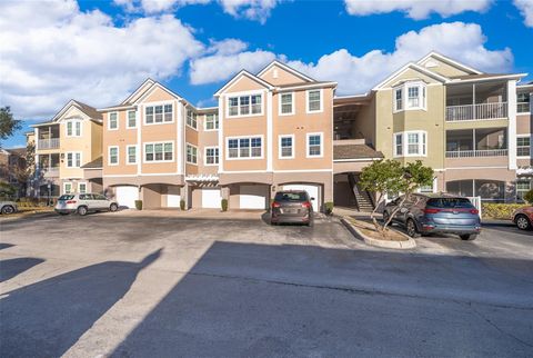 Photo of 6413 Astor Village Avenue #305, Orlando, FL 32835 (MLS # O6273470)