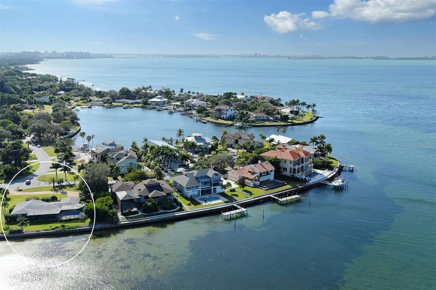 Under contract-accepting backup offers. Experience unparalleled views of Sarasota Bay and a true sanctuary of native wildlife, from the resident dolphins and manatees to flocks of migrating birds and painted skies at sunset. Located in the highly desirable neighborhood of Sapphire Shores, considered the next West of Trail Hot Spot, this presents an excellent opportunity to own a prime Sarasota Bayfront property. Situated on 0.57 acres with 187 feet of waterfront, this property offers spectacular views of the bay and the Ca d’Zan, the historic former home of John and Mabel Ringling. Sadly, this 2 bedroom 2.5 bathroom midcentury gem sustained storm damage. Just a block from Sapphire Shores Park, a beloved neighborhood gathering place. The property is also centrally located minutes from the Ringling Museum of Art, and the Asolo Theater. Its proximity also offers easy access to downtown Sarasota for shopping, dining, and world-famous beaches. Seller has recently obtained a Survey and confirmed the ability to install dock and boat lift.
