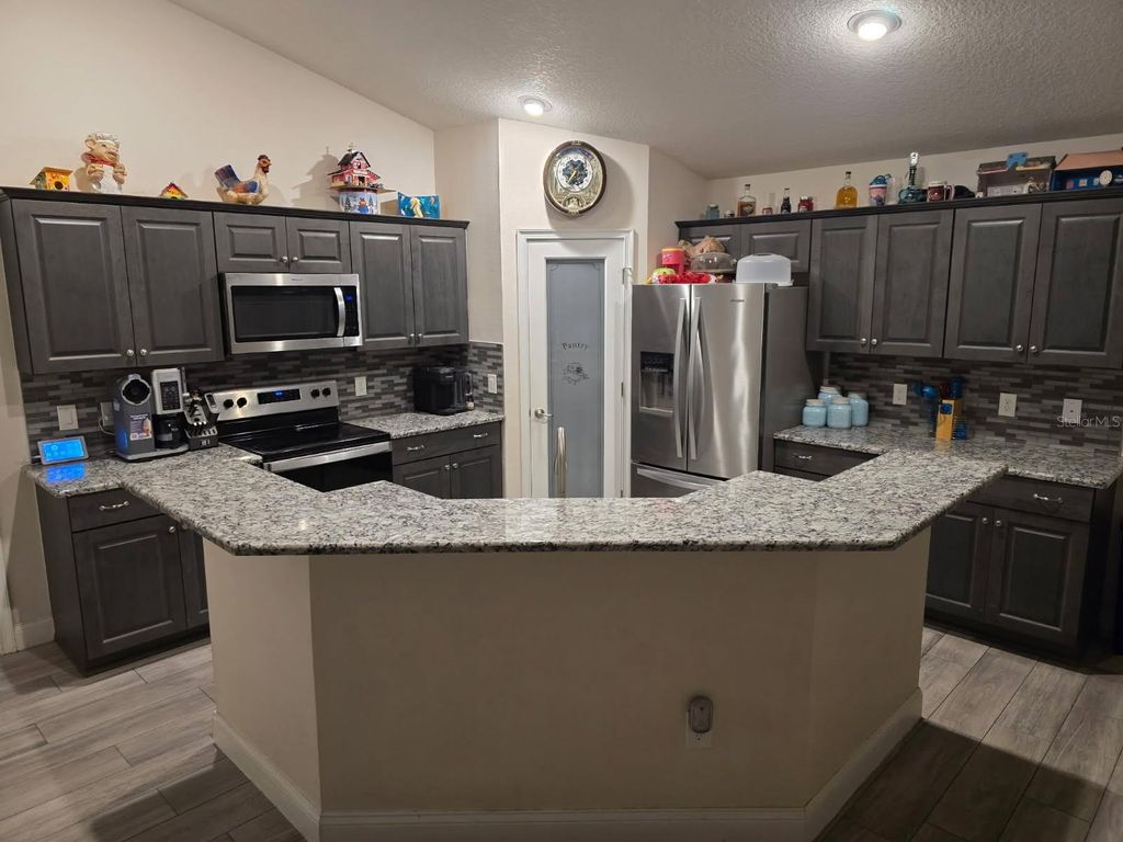 Photo of 854 Fisher Road, Ocklawaha, FL 32179 (MLS # O6325430)