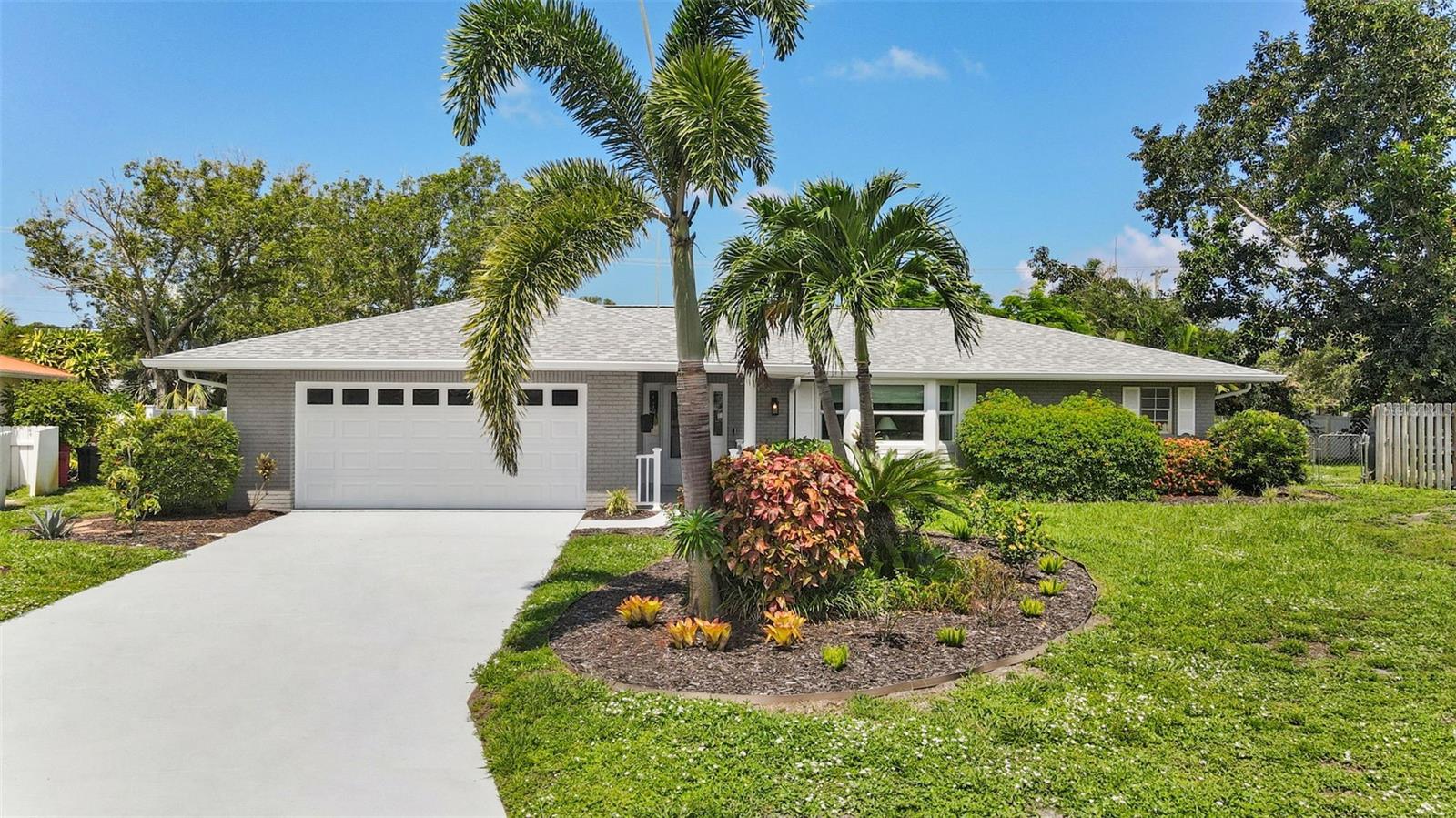 Just minutes from the sparkling sands of Anna Maria Island, this charming 2-bedroom, 2-bath home is tucked away in the sought-after Village Green community of West Bradenton. Nestled on a quiet cul-de-sac and set on nearly 1/3 acre, the fully fenced backyard offers privacy and space to relax or entertain.
With a BRAND NEW ROOF and FRESHLY INTERIOR AND EXTERIOR PAINT, the home feels clean, bright, and move-in ready. Inside, the split-bedroom floor plan ensures comfort and privacy, while the updated kitchen offers function, including space for a cozy bistro table. The spacious primary suite features an en-suite bath and a generous walk-in closet.
Enjoy year-round Florida sunshine in the enclosed Florida room, ideal for morning coffee, an art studio, or simply unwinding with a good book.
Located in FLOOD ZONE X, this community does NOT require flood insurance for most homeowners, offering peace of mind and lower ongoing costs.
Whether you’re drawn to the turquoise waters of the Gulf, peaceful nature trails, or the convenience of nearby shopping and dining, this location offers the best of Florida living.
Come discover your slice of paradise in West Bradenton; coastal charm, modern updates, and no flooding worries.