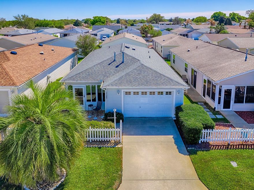 ~•Bond is PAID!•~ ~•Roof New in 2021•~ ~•HWH New in 2025•~ ~•HVAC New in 2018•~ Perfect for Florida Living or Rental Income! This Charming 2 bed, 2 bath TURNKEY COLONY patio villa in the village of Chatham offers a PRIME OPPORTUNITY for buyers looking for a LOW-MAINTENANCE home or an investment property in The Villages! This is a SPECIAL Colony patio villa = the Fridge has been been MOVED out of the corner, and additional cabinets and countertops added! The kitchen is a standout with GORGEOUS QUARTZ Countertops, a GAS Range, STAINLESS Fridge & Dishwasher (12/2025), White Cabinets w/Crown, and a SUNNY SOLAR TUBE. Enjoy easy living with LUXURY VINYL PLANK flooring in the Living, Dining Area and Kitchen. You'll find the perfect place to relax and enjoy the Florida landscape in the front GLASS-ENCLOSED LANAI. The spacious primary bedroom features a WALK-IN closet and EN-SUITE bath with Updated Walk-In Shower. Outdoor living is a BREEZE on the side patio. This CLEAN and BRIGHT villa with smart updates makes ownership simple and worry-free. WHOLE-HOUSE Surge Protector. Move in, relax, and start to enjoy your own slice of The Villages lifestyle today! Call today for a Private Showing! Great location that is easy in & out of The Villages w/light traffic even in PEAK Season! Just a gentle walk or quick golf cart ride to Chatham Rec Center & Family Pool. Also, FABULOUS and Nearby - the “First Responders” Recreation Center with Walk-in Pool, Pitch-N-Putt Golf Course, PICKLEBALL, and more! Close to Nancy Lopez Country Club, Several Pools (Adult & Family) and Mulberry Grove Rec Center. Shopping, Banking, Restaurants and the VA Center are nearby! Tax line reflects property taxes only, and is estimated. Bond is PAID. Current Maintenance Assessment is $452/year. Current Fire Dept. $284/year. Note: Square footage information is taken from the Public Record and is deemed reliable, but not guaranteed. Room and garage dimensions are approximate: buyer to verify.
