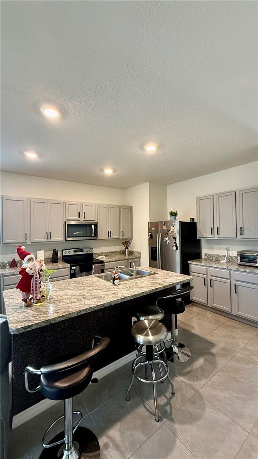 Photo of 317 Feltrim Reserve Boulevard, Davenport, FL 33837 (MLS # S5140300)