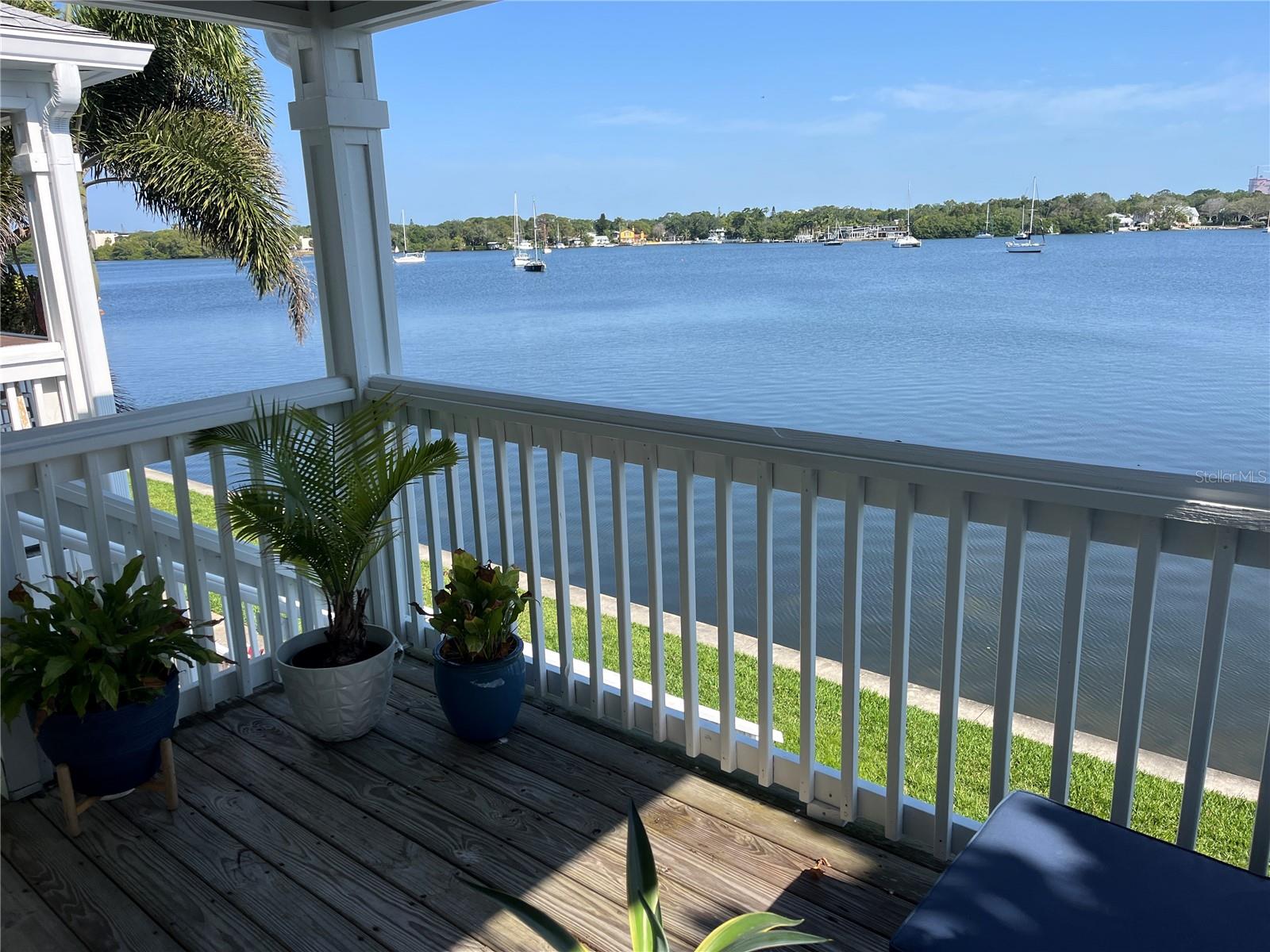 One or more photo(s) has been virtually staged. Salt water is good for the soul… and this beautiful waterfront condo is a retreat from the hustle and bustle of life. Imagine enjoying your morning coffee on the spacious balcony, while watching manatees and dolphins play. Unobstructed water views not only from the balcony, but the kitchen and living room as well. This 2 bedroom, 2bathroom condo is located on the second floor and offers a wonderful one story floor plan. The open kitchen has loads of cabinets for storage and granite countertops. There is a tub bath in the hall bathroom and a walk-in shower in the primary bathroom. A deeded covered parking space is included. Enjoy the Florida lifestyle every day, whether taking a stroll around the community lake, playing tennis or pickleball, taking in a swim at the heated community pool, or fishing right in front of your home. The landscaped grounds offer acres to walk your dog around the pet-friendly community or utilize the dog park. 2 pets per unit, max 60lbs. (check breed restrictions). Waterside at Coquina Key North is just 10 minutes south of vibrant downtown St. Petersburg, 15 minutes from St. Pete beach, easy access to I-275, and all you need nearby, including restaurants, museums, nightlife, Tropicana Field, and more! Condo fee includes Spectrum TV & internet, common area maintenance, insurance, water, trash, sewer, and secure gated entry as well as use of amenities (clubhouse, hot tub, pools, fitness center, etc.) at nearby Waterside at Coquina Key South, only 5 minutes away. This community allows rentals 4x/year less than 30 days, and no limit on rentals over 30 days (please confirm rental restriction in condo docs).”