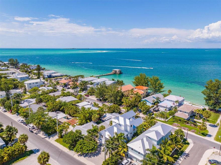 Stunning newer construction 4 bedrooms, 4.5 bathrooms heated pool home with views of the bay! This home is located on the highly desirable north end of Anna Maria Island. This spacious 2,381 Sq Ft home was professionally decorated. Open concept floor plan on the main floor features a kitchen island with quartz countertop, solid wood cabinets and stainless-steel appliances. It opens up to the living and dining room with stylish light fixtures. Right off the living room is a large balcony with 2 swings that overlook beautiful bay views! Secondary family room for guests. Three large bedrooms on the main floor and the main master bedroom is on the third floor, elevator access to all three levels. The master bedroom features gorgeous wallpaper, private balcony and large bathroom with dual sinks and a walk-in shower. Tropical landscaping overlooking your private heated pool and spa. Short stroll to the Rod N Reel pier, shops of Pine Avenue and white sand beaches.