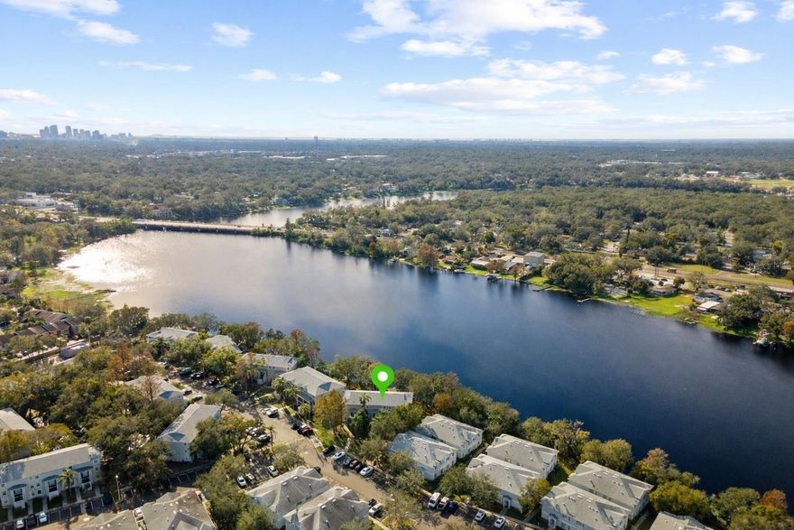 One or more photo(s) has been virtually staged. Dreaming of living on the water but thought it was out of reach? This is your opportunity to own a waterfront condo at an affordable price, with no flood insurance currently required.

Welcome to 7240 E Bank Drive #204, Tampa, FL 33617. This updated 2-bedroom, 1.5-bath condo offers peaceful views of the Hillsborough River and a convenient location near USF, downtown Tampa, major highways, shopping, and dining.

Enjoy direct access to waterfront living with opportunities for fishing, kayaking, and other water activities right within the community.

The unit features a spacious open floor plan with laminate flooring throughout. The kitchen includes granite countertops and stainless steel appliances. In-unit laundry closet with washer and dryer included. Screened balcony overlooks the water. Additional updates include new A/C (2023), new roof (2024), and updated plumbing valves.

The gated community offers guard access, riverfront pool, fitness center, playground, boat storage, and on-site laundry facilities. Pet-friendly community (buyer to verify restrictions).

Suitable for primary residence or investment (buyer to verify leasing restrictions and HOA requirements).

Schedule your private showing today.