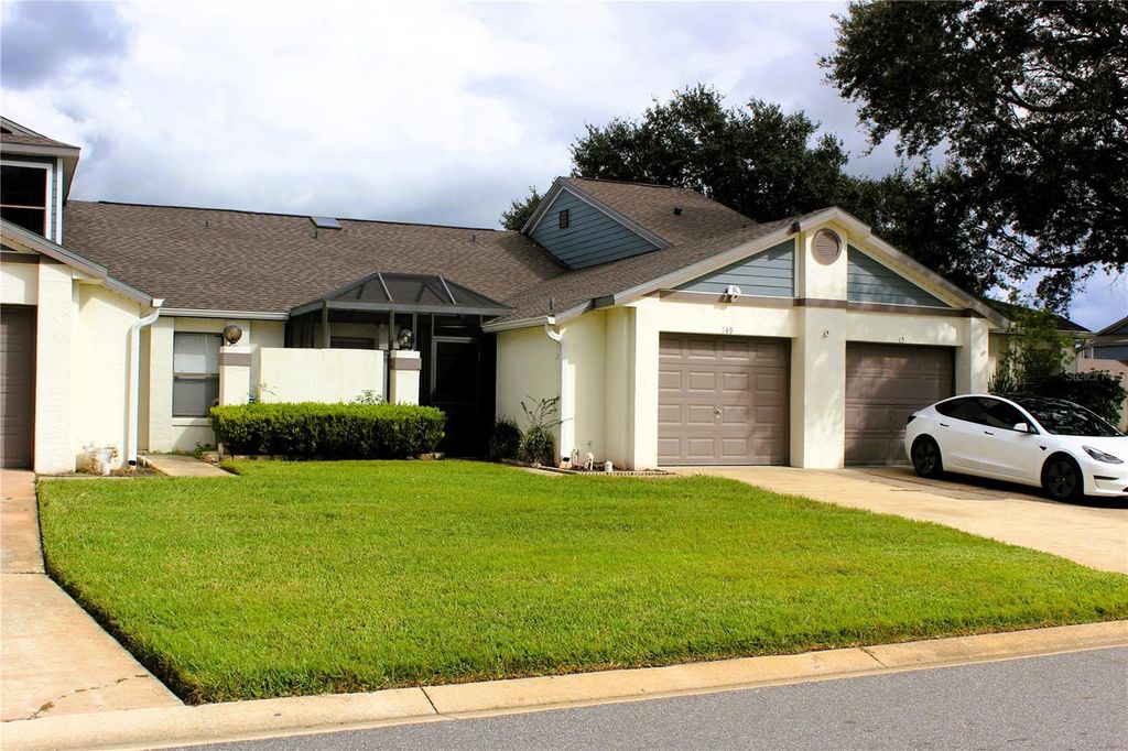 Photo of 149 Lakepointe Circle, Kissimmee, FL 34743 (MLS # O6351459)