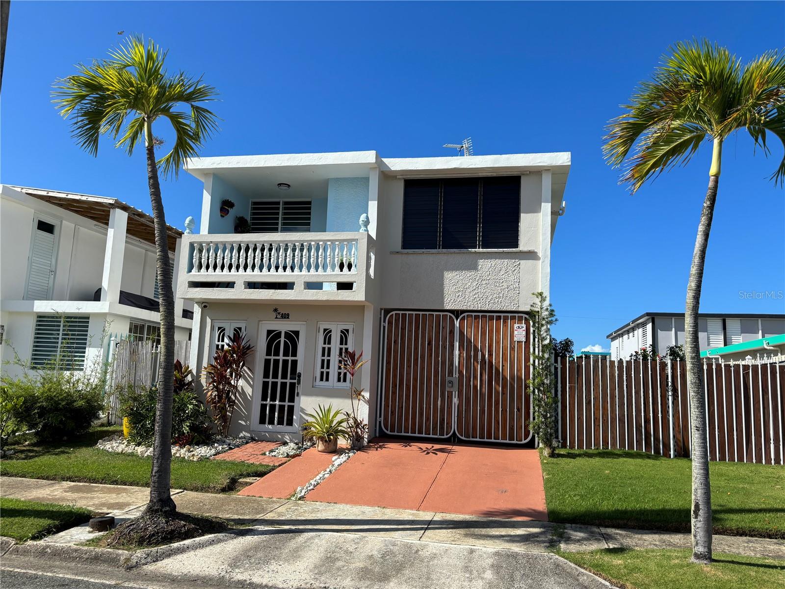 Experience resort-style living in a coveted Golf and beach community! This stunning home is situated within the grounds of a world-class golf course, renowned for hosting the PR Open PGA Tournament, and adjacent to the luxurious Hyatt Regency Resort. Enjoy the convenience of being just a short walk from the beach, with the breathtaking El Yunque Rainforest and the EspÃritu Santo ("Holy Spirit") river nearby. Whether you’re looking for a serene place to live or a great investment for short-term rentals, this 3 bed./3 bath. property has it all. Recently renovated and beautifully furnished, it is surrounded by a large yard filled with fruit trees, offering ample space to add a pool if desired. The first floor features a spacious carport, a covered terrace perfect for entertaining, BBQ's, a laundry room, and a full bath. Upstairs, you’ll find three bedrooms, two bathrooms, a well-equipped kitchen, a family/dining room, and a balcony with magnificent views of the rainforest. This house offers access to top-tier amenities including pools, tennis and basketball courts, a kids playground, and 24/7 security, ensuring a quiet and safe environment.
The neighborhood provides the perfect balance of tranquility and accessibility, with proximity to renowned tourist destinations, marinas, The Outlets Mall, and only a 30-minute drive to San Juan’s international airport. Ideal for those seeking a serene, yet active, lifestyle. Please call for a private appointment!