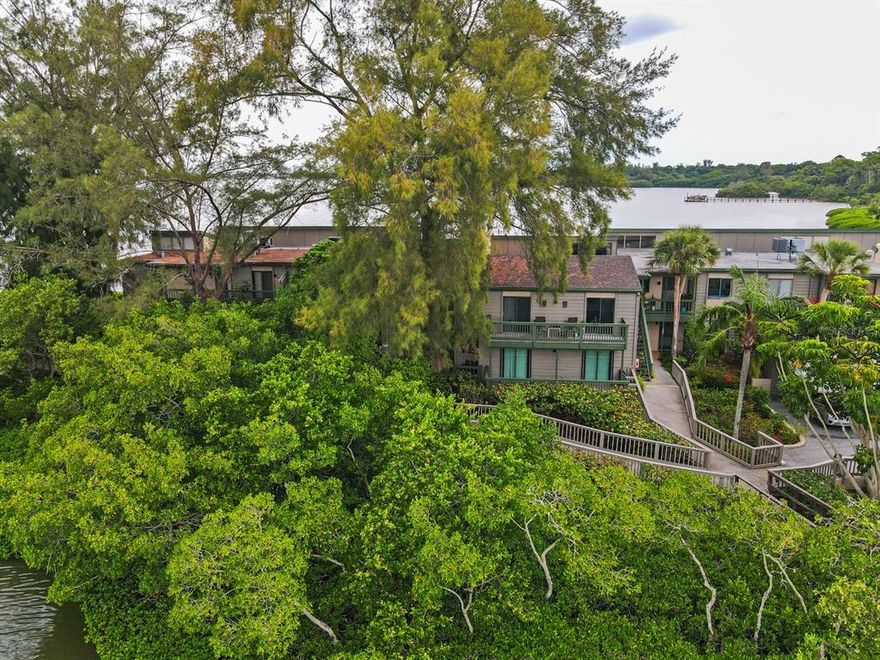 A rare opportunity to own a condo with breathtaking water views from every window. You will love this stunning 2 story condo located at Pelican Cove Point. This spacious two bedroom/two and a half bath townhome/condo is filled with plenty of natural sunlight, has an open-plan first floor, with three separate outdoor spaces. Panoramic Sarasota Bay sunsets just 18 steps from your front door. Amenities include: art studio, woodworking shop, sculpting garden, 6 pools, yoga, tennis, pickleball, water aerobics, biking, new exercise room and kayak launches to name a few activities. Enjoy an impressive offering of performing arts, annual art show, cinema & culinary club, bridge and fiber arts club.  Your Pelican Cove drive begins when the front gate lifts and the beauty of Pelican Cove unfolds. Majestic trees greet you and as your drive continues you discovery you have arrived at a magical botanical garden!  Pelican Cove is spread out over 75 acres of natural beauty, Every convenience 5  minutes away. Publix, Sprouts, Lowes, CVS, movie theatre, Costco, restaurants and much more!