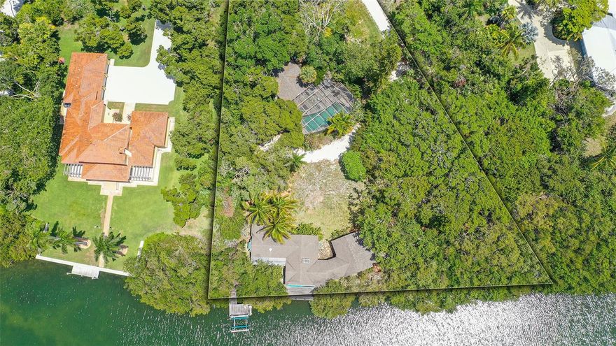 Under contract-accepting backup offers. For information only. See MLS # A4569257  This spectacular "Old Florida" waterfront lot with 252 feet on Bishop's Bayou has two structures in disrepair and is being sold for lot value.  Being sold As-Is, the seller will not make any repairs. The structure with the pool could be made livable for a temporary residence with lots of TLC. Please make offers on FloridaRealtor/FloridaBar 6 As-Is contract form and the attachments loaded in MLS along with proof of funds or pre-approval. Dock lift is not warranted. Seller was exempt from paying property tax.