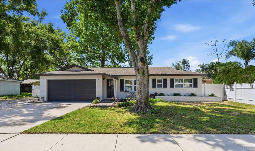 Welcome to this beautifully updated three-bedroom, two-bathroom home in the heart of Palm Harbor, offering the perfect blend of comfort and location. Situated on a jumbo-sized lot in a highly desirable area, you’ll love the convenience of being just minutes from local baseball fields, the Palm Harbor Library, and the growing selection of dining and shopping options along US-19 - including the new Trader Joe’s less than a mile away. The home has been thoughtfully updated throughout, starting with fresh exterior paint and continuing inside with a light and bright interior featuring new paint, an open floor plan, crown molding, and updated ceiling fans. Durable wood-look vinyl flooring runs seamlessly throughout the home, enhancing the functionality. The kitchen is designed for both everyday living and entertaining, showcasing quartz countertops, stainless steel appliances, ample cabinetry, and a breakfast bar that opens to the dining area. The split floor plan provides privacy, with a spacious primary suite offering a walk-in closet with built-in organizers and a beautifully renovated en-suite bathroom complete with a glass-enclosed shower, rain showerhead, stone-top vanity, and updated lighting. The additional bedrooms are nicely sized, each with ceiling fans, and share a full bathroom with a tub/shower combination. Step outside to a screened-in porch - perfect for enjoying Florida’s weather year-round - overlooking a large fenced backyard with plenty of space to grill, garden, or even add a pool. Additional highlights include a 2025 water heater, no HOA, and zoning for excellent schools. This move-in-ready home combines modern updates with an unbeatable Palm Harbor location - don’t miss your opportunity to make it yours. Schedule your showing today!