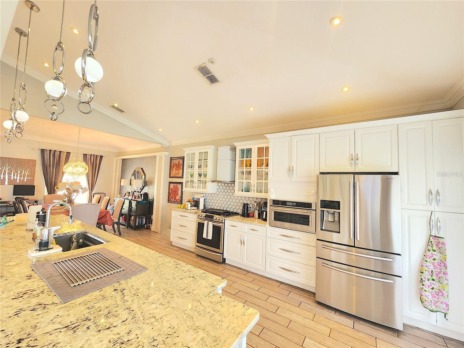 Discover your dream home in the desirable Bellalago community, where this stunning two-story residence offers spacious living with four bedrooms and two and a half bathrooms, perfect for families seeking comfort and privacy. Upstairs, enjoy a grand loft with serene waterfront views and three bedrooms that provide a peaceful retreat from the primary suite downstairs. The remodeled open-concept kitchen is a chef’s delight, featuring ample storage and seamlessly flowing into the dining and living areas, ideal for gatherings and entertaining. Step outside to a beautiful backyard overlooking the lake, perfect for enjoying Florida’s gorgeous weather. Additional highlights include a two-car garage, convenient laundry room, and access to fantastic community amenities such as a pool, tennis courts, playground, and clubhouse. Don’t miss the opportunity to tour this exceptional home and experience it all!