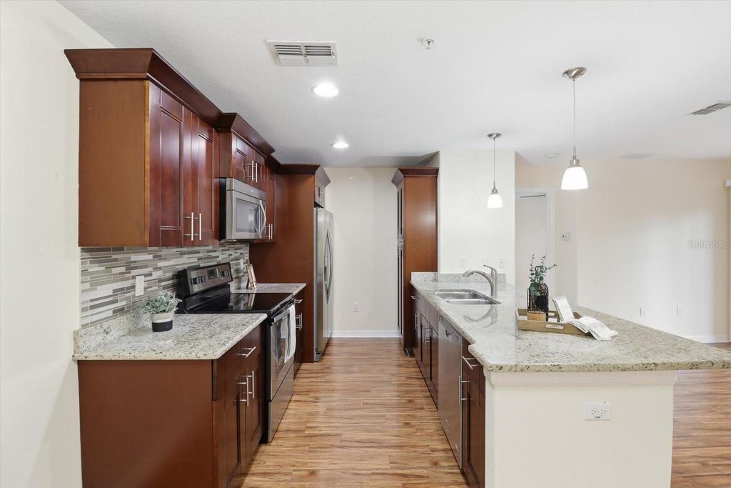 Photo of 5041 Royal Palms Way #202, New Port Richey, FL 34652 (MLS # W7881706)