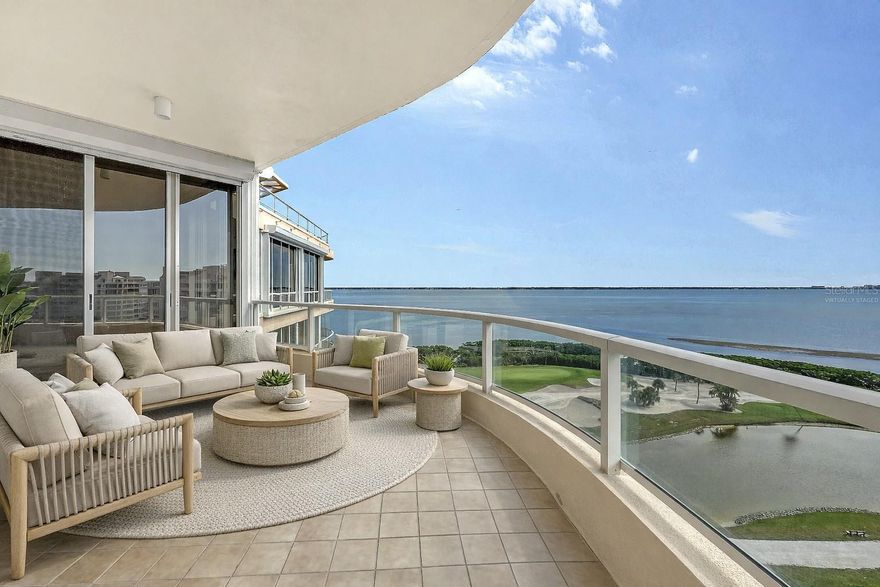 One or more photo(s) has been virtually staged. Positioned high on the south side and 9th floor of Building One, this turnkey-furnished residence at Grand Bay offers expansive Sarasota Bay, golf course and downtown views, refined interiors, and effortless resort living on Longboat Key. Spanning nearly 2,300 square feet, the open layout is framed by walls of glass and a wraparound terrace with access from nearly every room—creating a seamless connection between indoor spaces and the ever-changing water views below.
Recently refreshed with new contemporary furnishings included, the residence is truly move-in ready. The spacious great room flows naturally into the dining area and kitchen, creating an inviting setting for entertaining or relaxed daily living. Floor-to-ceiling glass sliders bring in abundant natural light while showcasing views of the bay, marina, and downtown Sarasota.
The primary suite is a private retreat with terrace access, generous closet space, and a well-appointed en-suite bath. Two additional bedrooms provide flexibility for guests, office use, or extended stays, each positioned to enjoy natural light and views. Electric storm shutters throughout offer convenience and peace of mind.
This residence includes two deeded parking spaces and an additional storage unit, a valuable combination rarely available at this elevation.
Grand Bay is one of Longboat Key’s most sought-after gated communities, offering residents a full suite of resort-style amenities including two heated swimming pools with sundecks, Har-Tru tennis courts, a modern fitness center, clubhouse, and an active social calendar. On-site management and 24-hour security ensure a well-maintained, secure environment. As an exclusive benefit, owners enjoy deeded access to the private Bay Isles Beach Club, where Gulf-front pavilions, grilling areas, and pristine shoreline create the perfect setting for beach days and sunset gatherings.
Located behind the gates of Bay Isles, Grand Bay balances privacy with proximity. Just minutes away are the boutiques and restaurants of St. Armands Circle, the cultural offerings of downtown Sarasota, championship golf and marina access at Harbourside, and the beaches of Lido and Siesta Key. From boating and tennis to theater, dining, and art, this residence places the best of Sarasota living within easy reach.
A rare opportunity to enjoy turnkey bayfront living in one of Longboat Key’s premier communities.