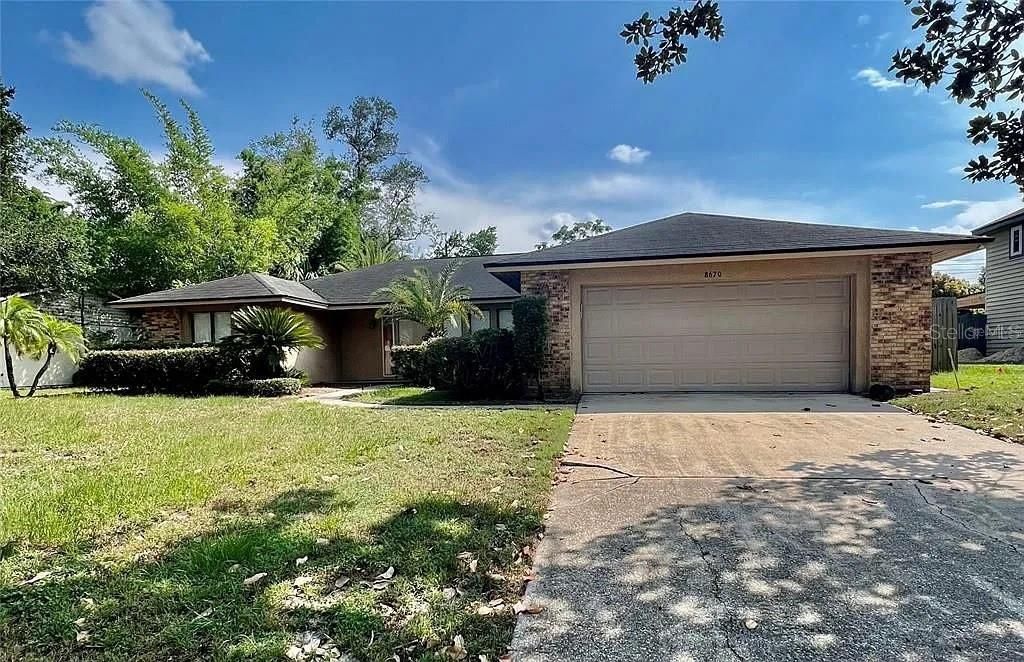 Photo of 8670 Larwin Lane, Orlando, FL 32817 (MLS # O6363878)