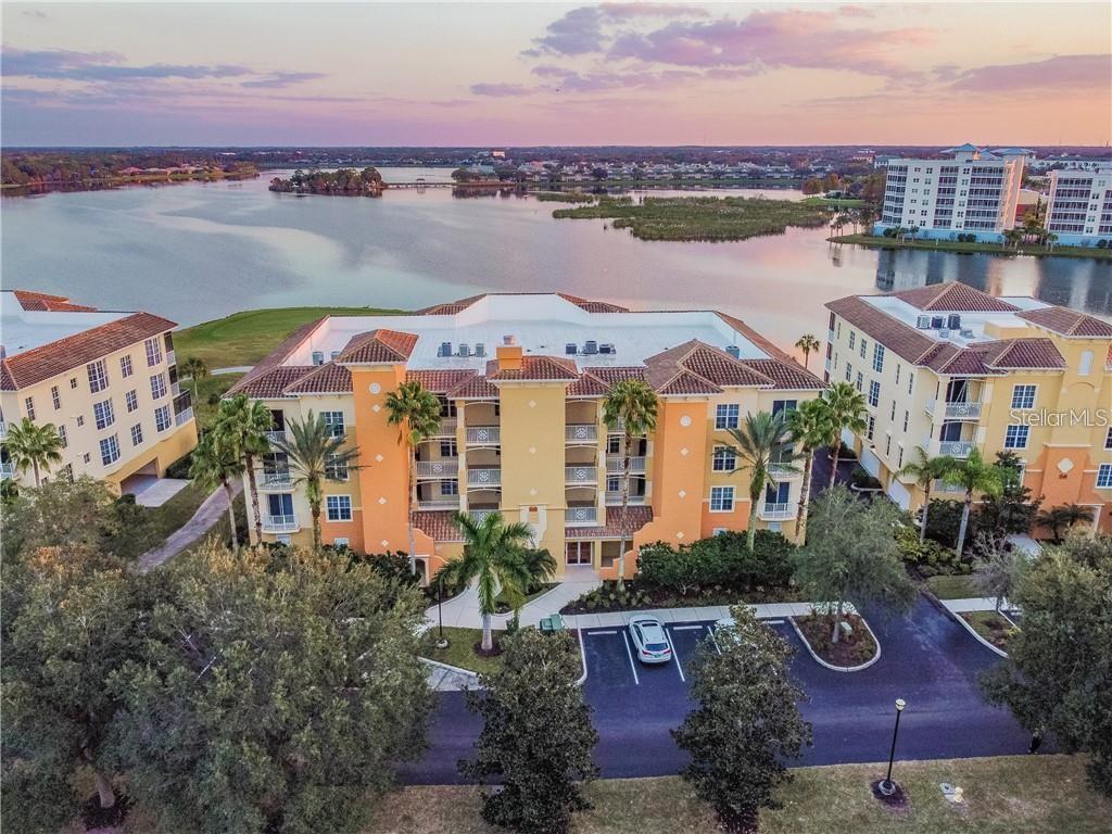 Immaculately Maintained Watercrest Condo Overlooking Lake Uihlein! Featuring 3 Bedrooms, 2 Bathrooms and a
Covered 2 Car Garage! Absolutely Amazing Unobstructed Water and Golf Course Views from this Beautiful Second-floor Watercrest residence.
Tile flooring flows throughout the living area with warm newer carpets in the bedrooms. Sophisticated interiors are enhanced by accented Crown Molding, Energy-Efficient Features, and pleasing aesthetics throughout. The great room is open to the kitchen with Tile Backsplash, Cabinetry with Pull-Outs, Granite Countertops and an Expansive Breakfast Bar. Sliders open to allow breezes rolling in from the lake through the screened lanai that creates the perfect atmosphere to enjoy morning coffee while watching the sky change colors. The master suite is a sanctuary of rejuvenation with water views, French doors to the lanai, and a sumptuously updated en-suite bath including a separate
shower, garden tub and dual vanities. There is even your own private 2 Car Garage underneath the building! Watercrest is a private, gated community with an elevator and resort-inspired, two-story clubhouse. Enjoy endless amenities including the entertainment room, fitness center, meeting room, kitchen, heated pool and spa, and veranda sundeck within walking distance to the Lakewood Ranch Main Street for shopping and dining.