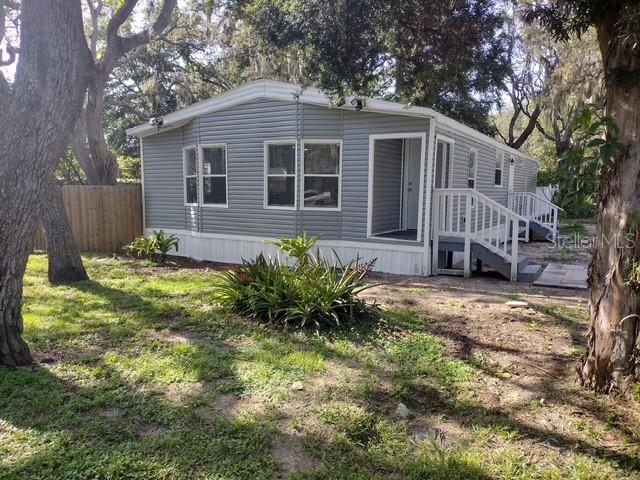 This beautifully renovated 2-bedroom, 2-bath mobile home sits on a spacious 12,625 sq ft lot in a peaceful New Port Richey neighborhood. Every detail has been updated — from the modern kitchen and updated bathrooms to new flooring, fresh paint, and upgraded fixtures throughout. The open-concept layout offers bright, airy living spaces perfect for comfortable living or entertaining. Enjoy the generous outdoor space with plenty of room for gardening, recreation, or future expansion. Conveniently located minutes from shopping, dining, and the Gulf beaches, this turnkey home is ideal for first-time buyers, or investors seeking a low-maintenance rental with strong ROI potential. Don’t miss out on this like-new gem in a prime location!
