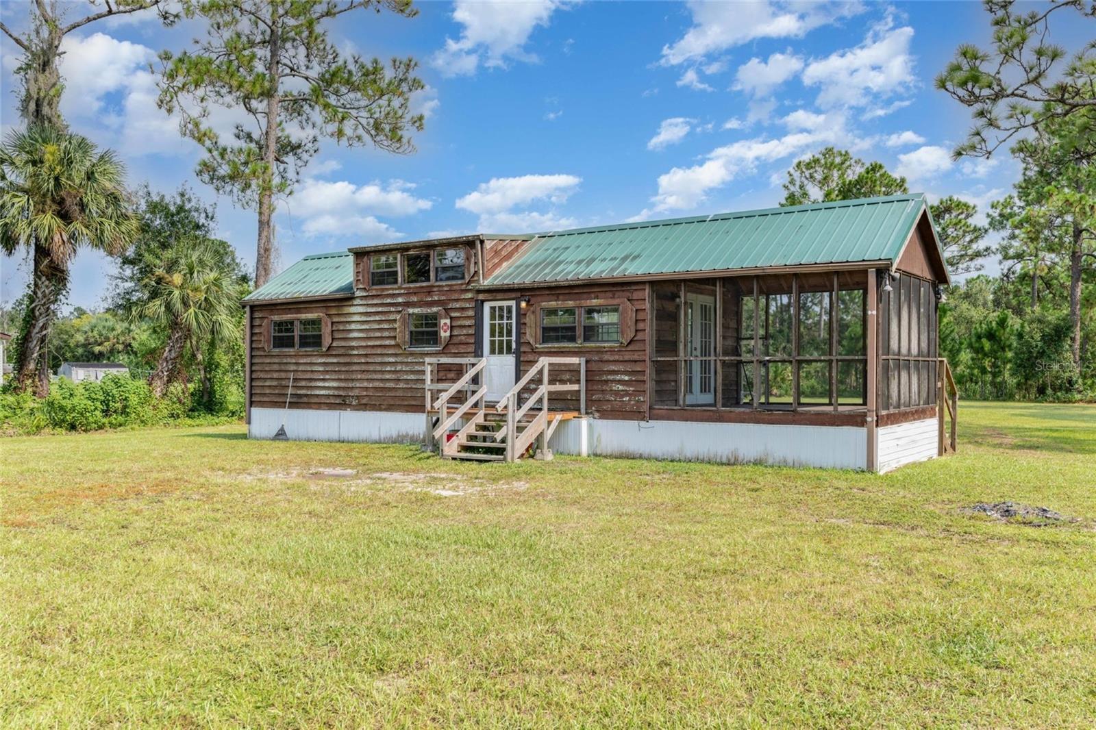 Discover 4.91 acres of natural Florida beauty, complete with a serene pond and abundant native surroundings. Tucked away in its own private setting, this property offers endless opportunities for those seeking space and a connection with nature. A manufactured home currently sits on the property -offering little value but fully livable-providing a starting point while you plan, build or simply enjoy the land as it is. With the combination of acreage, water feature, and usable living space, this property is a rare find. Sale includes Tax ID's #2002081 & #2002100