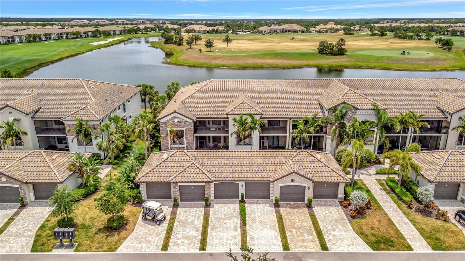 Price Improvement!Beautiful CUSTOM South facing TURNKEY FURNISHED Arabella model veranda within Lakewood National Golf Club.This is the largest of all veranda units with plenty of upgrades.These include;Freshly painted kitchen cabinets,tile backsplash,luxury vinyl plank flooring in both bedrooms and den,custom dry bar and wall unit with fireplace,closet organizers in both master closets and crown molding to name a few.As with all of the end units this veranda has three extra windows in both bathrooms and the den for plenty of natural light.Gorgeous views overlooking the lake,driving range, and Piper 9 will not disappoint!With the purchase you will enjoy immediate membership to 36 holes of Arnold Palmer championship golf that has been rated extremely high by Golf pass for several years.Within Lakewood National you find top-notch amenities which include: 24 hour manned security gate,tiki bar,zero entry resort style pool with waterfalls,28,000 sq ft clubhouse for fine dining,pickleball,tennis, bocce ball and a full-time lifestyle director to give the residents a fun social life.Lakewood Ranch has been the #1 community for all ages for the last 7 years.With close proximity to fine dining,shopping, and world-class beaches this community is the perfect choice to call home.GOLF CART INCLUDED!