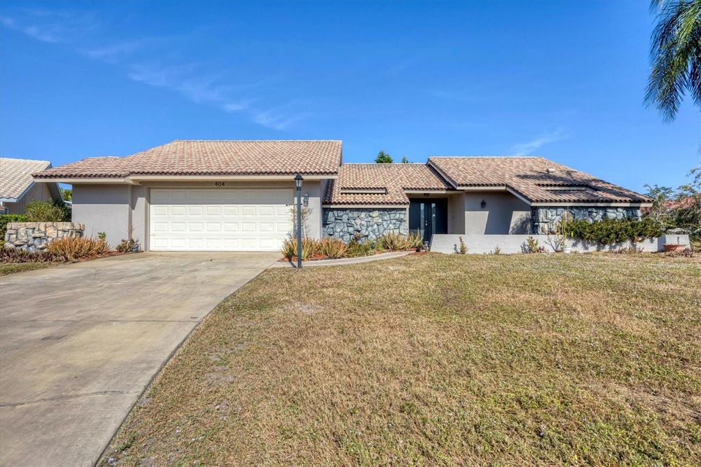 Photo of 404 Firethorn Avenue, Englewood, FL 34223 (MLS # C7518953)