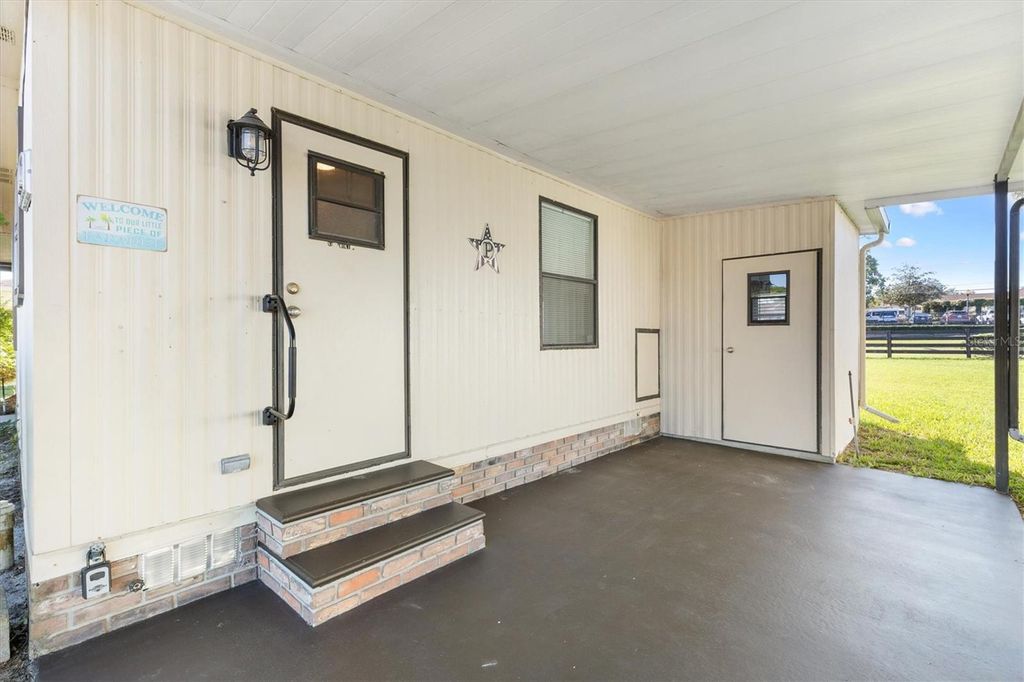 Photo of 610 Tarrson Boulevard, Lady Lake, FL 32159 (MLS # G5103904)