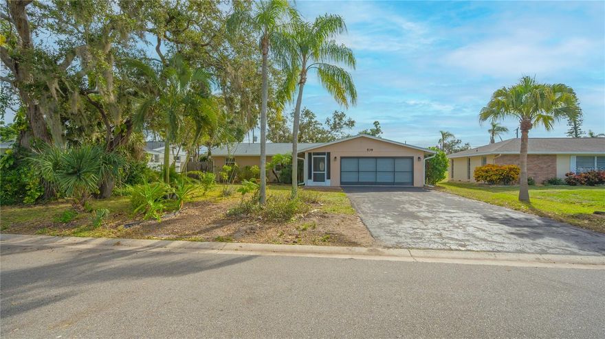 Multiple Offers. Highest and Best due by Thursday, Jan 11 at 7pm  A lovely 3 bedroom, 2 bath home with an open floor plan and ceramic tile throughout awaits you! Centrally located in Venice, this neighborhood boasts NO HOA and NO Deed Restrictions!!!
This home features a new roof in 2021; re-piped in 2023; new water heater in 2023; freshly painted interior; new gutters and downspouts installed in 2023; and a whole house water filter and water softener.
This property provides a spacious fenced backyard where you can putz in your own garden or relax on your brick pavered lanai and enjoy the many trees on the property including oak trees, avocado, peach, peanut butter, cashew and mango trees. The landscaping is a diamond in the rough, awaiting your tweaking! There is a well for irrigation. 
The 2-car garage boasts a durable epoxy floor. There is a home warranty provided for your convenience and peace of mind. 
This home is located near all that Venice has to offer:  Beaches, shopping, the arts and easy access to Sarasota and the Interstate. Don’t miss this comfortable home!