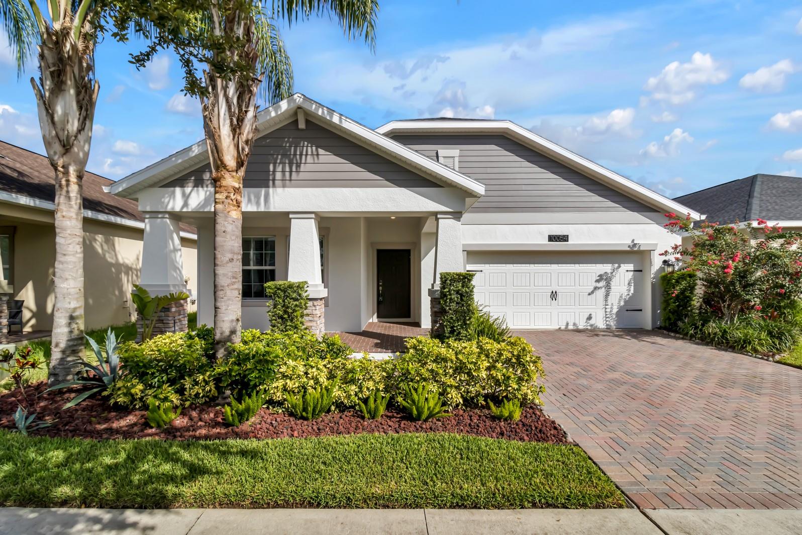 Welcome to this beautiful 3-bedroom, 2-bath single-family home in the highly sought-after Oaks at Moss Park community! This open-concept layout features high ceilings, abundant natural light, and a modern kitchen perfect for entertaining. Step outside to a fully fenced backyard with no rear neighbors and a peaceful pond view—your own private retreat. The garage includes a Level 2 electric vehicle charging station, and dogs are welcome, making this home both convenient and pet-friendly. Located just steps from the community playground, pool, and nature trails, this home offers unmatched amenities. Cable and high-speed internet are included through the HOA, and the owner provides lawn care and pest control for added peace of mind. Zoned for top-rated Lake Nona schools and minutes to Medical City, 417, and 528. Perfect for families or professionals looking for comfort, space, and lifestyle.