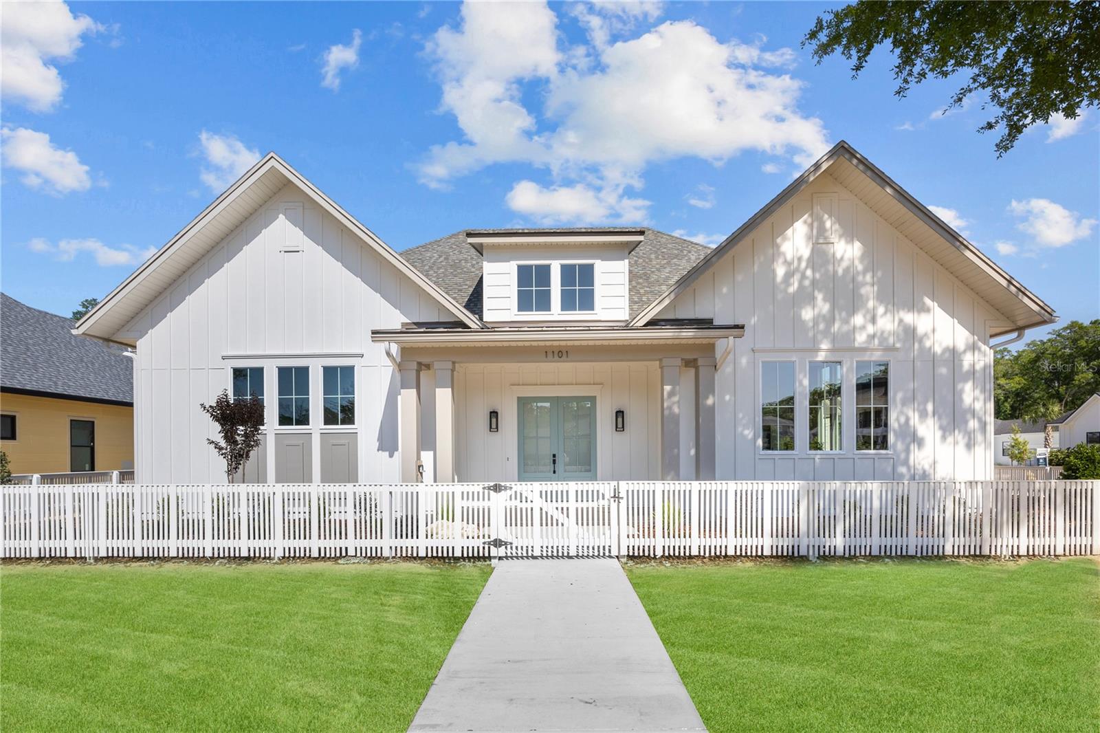 This exquisite Warring Homes 4-bedroom, 4-bathroom custom home is nestled in the award-winning, golf cart-friendly neighborhood of Town of Tioga. Showcasing a traditionally designed symmetrical exterior, this home exudes timeless elegance while offering modern conveniences.
Step inside to an open floor plan that is bathed in natural light with high ceilings providing a warm and inviting atmosphere. The primary suite, conveniently located on the first floor in its own private wing, boasts a spacious dressing room, ensuring a serene retreat. Thoughtfully designed for functionality, this home includes only one bedroom and bath on the second floor, a large pantry, oversized laundry room prepped for a refrigerator , and a drop zone, making daily living a breeze. The large back porch, summer kitchen and a full bathroom off the pool area offers additional convenience, ideal for outdoor entertaining.
The 3-car garage provides ample space for vehicles and storage, accommodating all your needs. Located in a charming and tranquil setting, this home is just a stone's throw away from shopping and recreational facilities, offering the perfect balance between peace and accessibility. Neighborhood amenities include – pickleball court, clubhouse, community pool, playground, tennis courts, sand volleyball, basketball courts, walking trails, and adjacent to Tioga Town Center with fine dining, shopping, and Gainesville Health and Fitness. Approximately 4 miles to I-75, 4.5 miles to North Florida Regional, 8 miles to the University of Florida, and 11 miles to Shands.