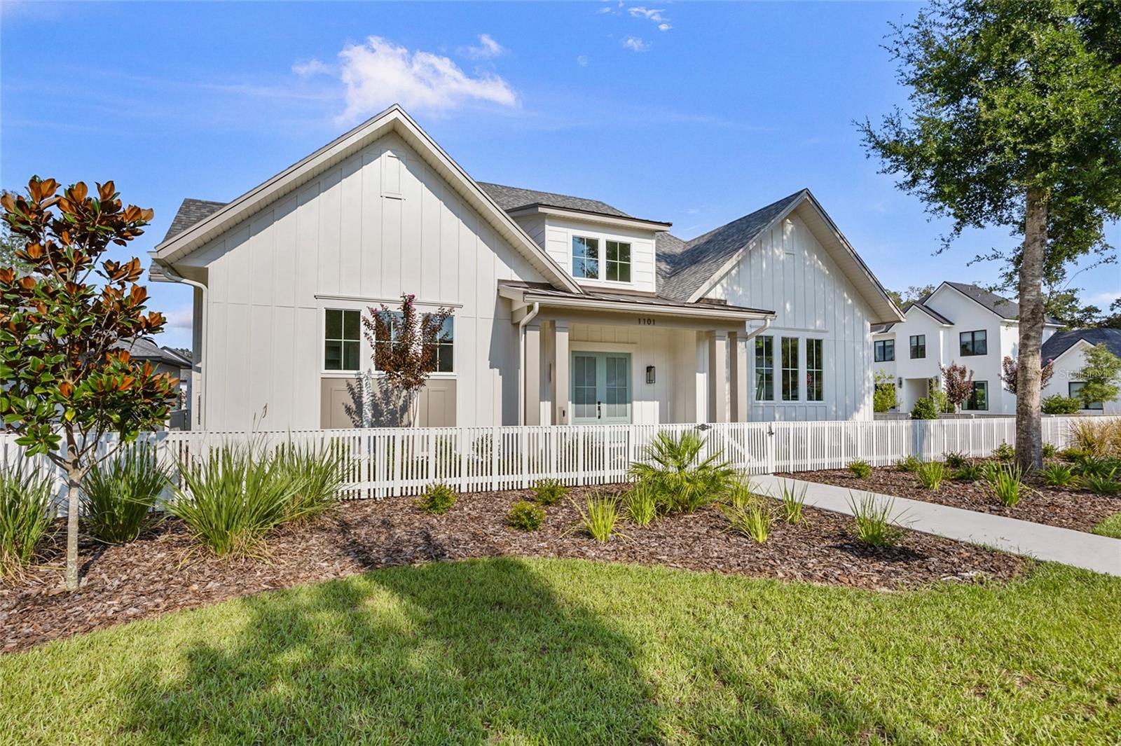 This exquisite Warring Homes 4-bedroom, 4-bathroom custom home is nestled in the award-winning, golf cart-friendly neighborhood of Town of Tioga. Showcasing a traditionally designed symmetrical exterior, this home exudes timeless elegance while offering modern conveniences.
Step inside to an open floor plan that is bathed in natural light with high ceilings providing a warm and inviting atmosphere. The primary suite, conveniently located on the first floor in its own private wing, boasts a spacious dressing room, ensuring a serene retreat. Thoughtfully designed for functionality, this home includes only one bedroom and bath on the second floor, a large pantry, oversized laundry room prepped for a refrigerator , and a drop zone, making daily living a breeze. The large back porch, summer kitchen and a full bathroom off the pool area offers additional convenience, ideal for outdoor entertaining.
The 3-car garage provides ample space for vehicles and storage, accommodating all your needs. Located in a charming and tranquil setting, this home is just a stone's throw away from shopping and recreational facilities, offering the perfect balance between peace and accessibility. Neighborhood amenities include – pickleball court, clubhouse, community pool, playground, tennis courts, sand volleyball, basketball courts, walking trails, and adjacent to Tioga Town Center with fine dining, shopping, and Gainesville Health and Fitness. Approximately 4 miles to I-75, 4.5 miles to North Florida Regional, 8 miles to the University of Florida, and 11 miles to Shands.