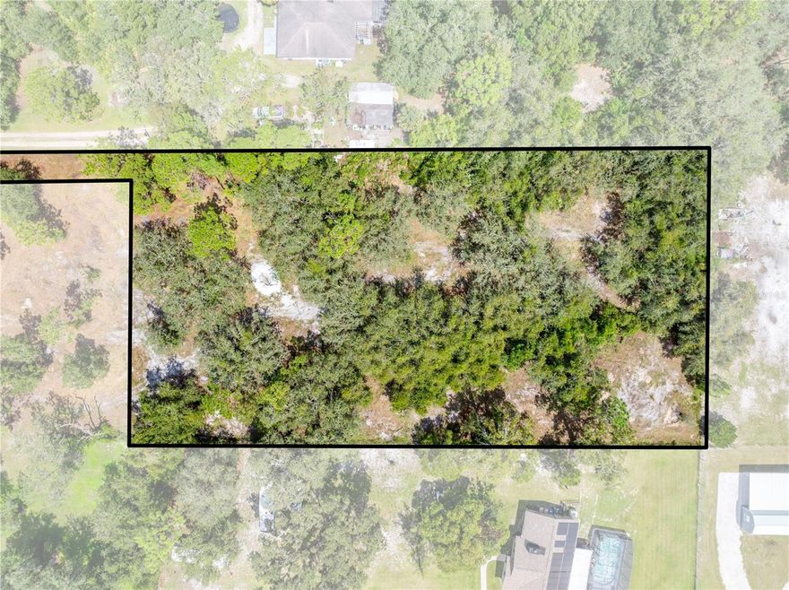 Check it out!! Build your dream home on this beautiful 1.33 acre lot in Saint Cloud, FL! Zoned for a single-family home with an accessory dwelling unit (ADU), this property offers flexibility and potential. Power is available at the road, and a well and septic will be needed once you build. The land is dotted with scrub oaks, pines, and mature oak trees, creating a peaceful, natural setting ready for your vision. Enjoy the convenience of a newly paved road, and the ideal location — just minutes from two golf courses, close to the beaches, and only 45 minutes to Orlando International Airport and the theme parks. Opportunities like this don’t last long — make it yours today