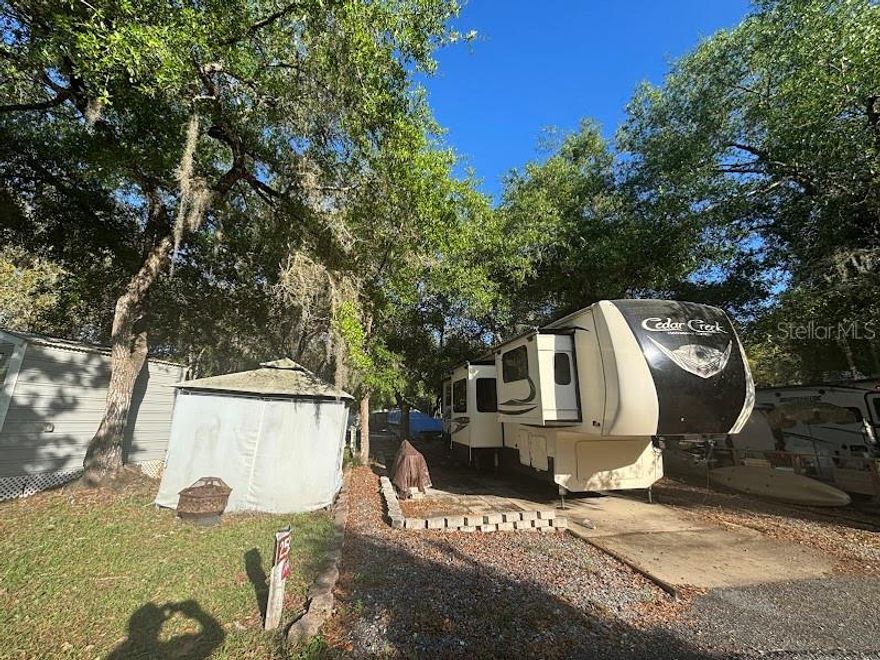 DEEDED RV LOT AVAILABLE - Quiet part of the resort - Motivated seller - Reconnect with nature and make your memories at the popular Salt Springs Resort. Salt Springs Resort is a gated resort / campground located in the heart of the 383,000-acre Ocala National Forest and on the shores of Little Lake Kerr in Salt Springs, Florida. Nestled amidst 100-year-old oaks covered in Spanish moss, the resort is clean, rich in nature, with small town charm. Come and share a relaxing atmosphere with family and friends. Along with the relaxed atmosphere, our surroundings include a spacious lakefront lodge, a boat ramp and fishing dock,1 adult pool,1 family pool,1 children’s pool and a spa, ¼ mile of lakefront, horseshoes shuffleboard, billiards, tennis courts, basketball, and much more. Hikers have easy access to the Florida National Scenic Trail, and the many surrounding rivers, two of the top ten bass fishing lakes, and streams provide ample opportunity for water activities. Whether enjoying the blue waters of Little Lake Kerr or the wilderness of the Ocala National Forest, you will find the area unique, diverse, and accommodating.