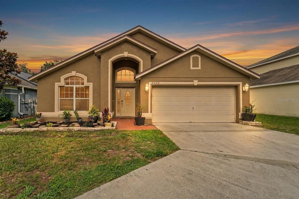 Photo of 8376 Lake Amhurst Trail, Orlando, FL 32829 (MLS # O6412653)