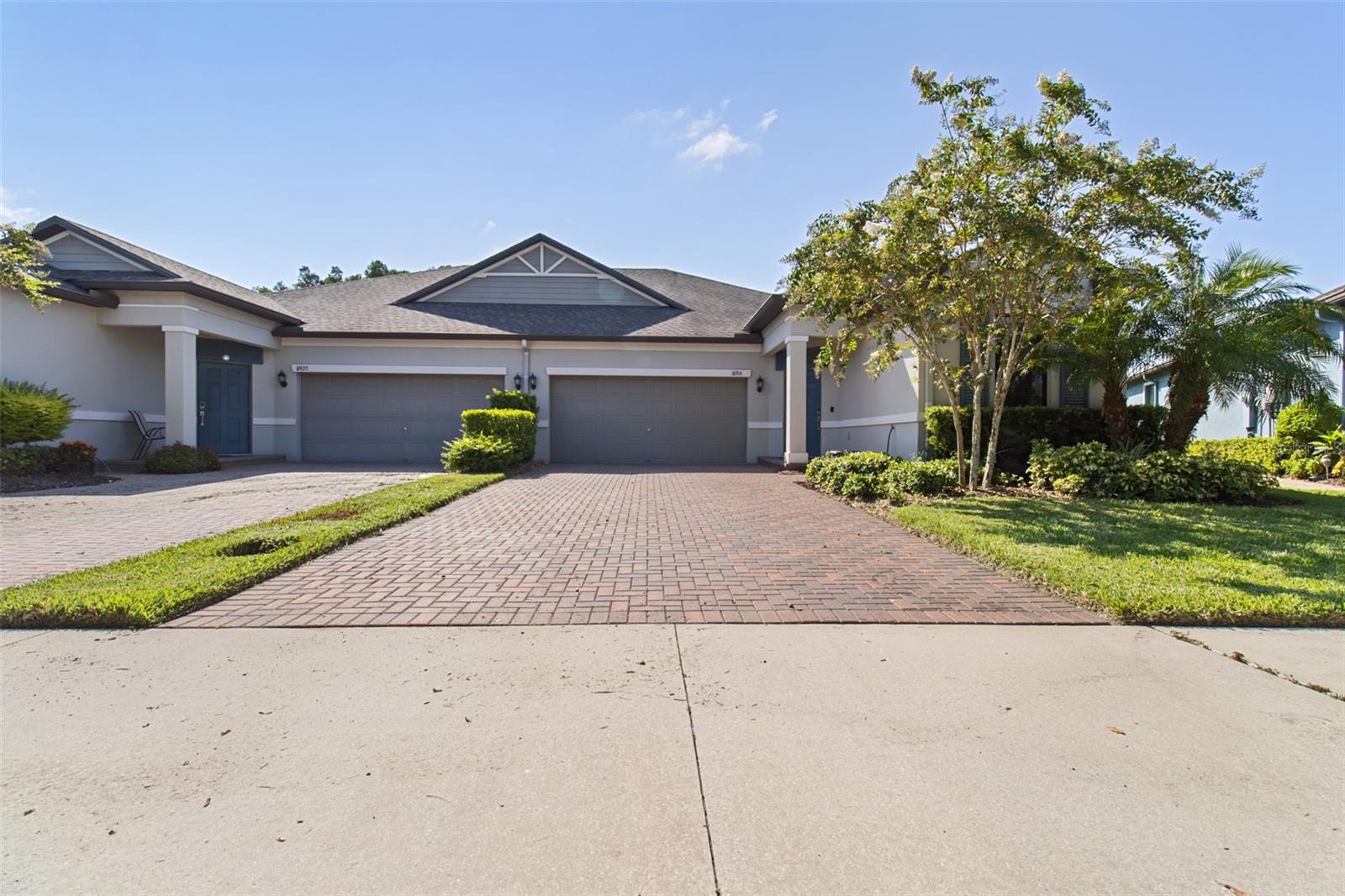 Lakefront luxury meets maintenance free living in this stunning villa, beautifully situated on a larger lot in the highly sought-after Bexley community. Enjoy serene lake views, an extended screened-in lanai for true porch vibes, and a driveway that's larger than most villas in the neighborhood — perfect for extra parking and convenience. This three-bedroom, two-bath home features an open-concept layout with tile flooring throughout the main living areas and plush carpet in the bedrooms. The upgraded kitchen boasts a large island, stainless steel appliances, solid surface countertops, raised-panel cabinets with crown molding, and a spacious walk-in pantry. One of the home’s most unique and functional features is the cleverly designed laundry area — discreetly located just behind the kitchen — offering a folding station and keeping the laundry hustle hidden from sight. The washer and dryer are included, making this space move-in ready. The split-bedroom floor plan offers added privacy, while the spacious primary suite includes a spa-inspired en-suite bath and a massive walk-in closet. Energy-efficient Low-E dual-pane windows and a tankless water heater provide modern efficiency. Residents of Bexley enjoy resort-style amenities including pools, a fitness center, clubhouse, walking and biking trails, a dog park, tennis courts, and an open-air game room. PLUS, the HOA takes care of the Lawn so no need to sweat in this heat! This villa offers the perfect blend of comfort, style, and peaceful lakefront living — don’t miss your chance to call it home!
Seller offering Buyer up to $500 Home Warranty at closing!