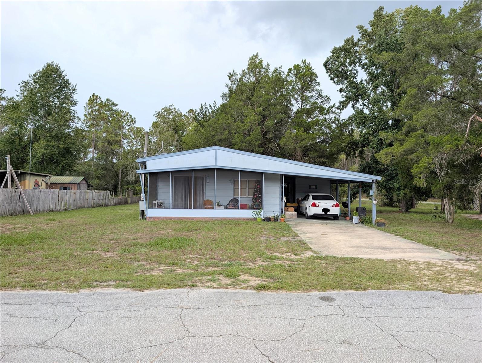 2 BEDROOM 1BATH ON 2 LOTS .62 OF AN ACRE. GREAT LOCATION. NEAR DUNNELLON, OCALA AND CRYSTAL RIVER. PUBLIC BOAT RAMP CLOSE BY. THIS LARGE LOT .62 OF AN ACRE. (2 LOTS) LARGE SHED ** ROOM FOR ALL THE TOYS AND THE IN-LAWS ALSO! For Equestrians, you are 15 minutes from Ross Prairie Trailhead and 35 minutes to the World Equestrian Center. You are also 15 minutes to downtown Dunnellon, 20 minutes to the Rainbow River for swimming, tubing, kayaking, and boating. 20-25 minutes to Ocala for restaurants and shopping. Near THE SHOPPES at BLACKDIAMOND, check out this home located near the Withlacoochee River. carport, shed/workshop, living room, kitchen open which leads to screen porch.MAKE YOUR APPOINTMENT TODAY! YOU DON'T WANT TO MISS THIS ONE!