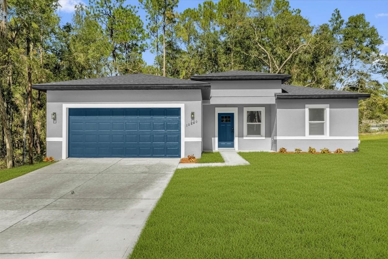 Brand-new modern home in Citrus Springs! This stunning 4-bedroom, 2-bathroom residence sits on a spacious corner lot and combines contemporary design with everyday comfort. The open-concept layout is ideal for entertaining, featuring a bright living and dining area that flows into a beautiful kitchen equipped with stainless steel appliances—including a refrigerator, range, dishwasher, and microwave. The private master suite offers a beautifully designed bathroom with double vanities and elegant tile finishes. With 1,833 sq. ft. of living space and a 2-car garage, this home offers the perfect blend of elegance and functionality. Conveniently located near shopping, dining, and medical facilities.  Only 45 minutes to Ocala’s World Equestrian Center and about an hour to Tampa or Orlando. Easy showing, come see this property today!