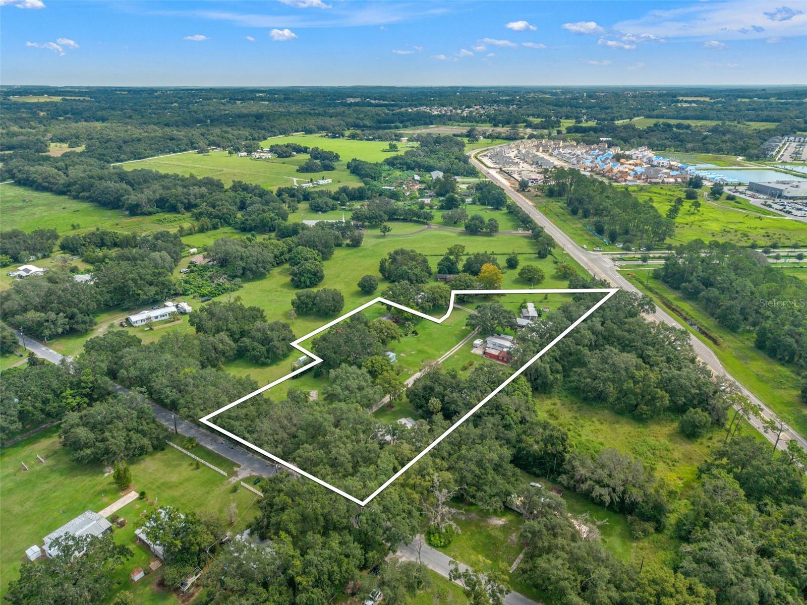 Prime opportunity in the heart of San Antonio, FL off of SR 52! This 3.61-acre parcel is zoned commercial and perfectly positioned for growth. Located just minutes from I-75, the property sits directly across the street from major anchors like Publix and 7-Eleven, and the future site of AdventHealth Center. The area is booming with development — surrounded by tons of brand new apartments, townhomes, and a wide array of national retailers and restaurants including Starbucks, Walmart, Wawa, Chipotle, and more. Close to the highly sought-after Mirada community with its expansive lagoon, this property offers incredible visibility and accessibility in a rapidly expanding market. An excellent location for your next investment or agricultural business venture!