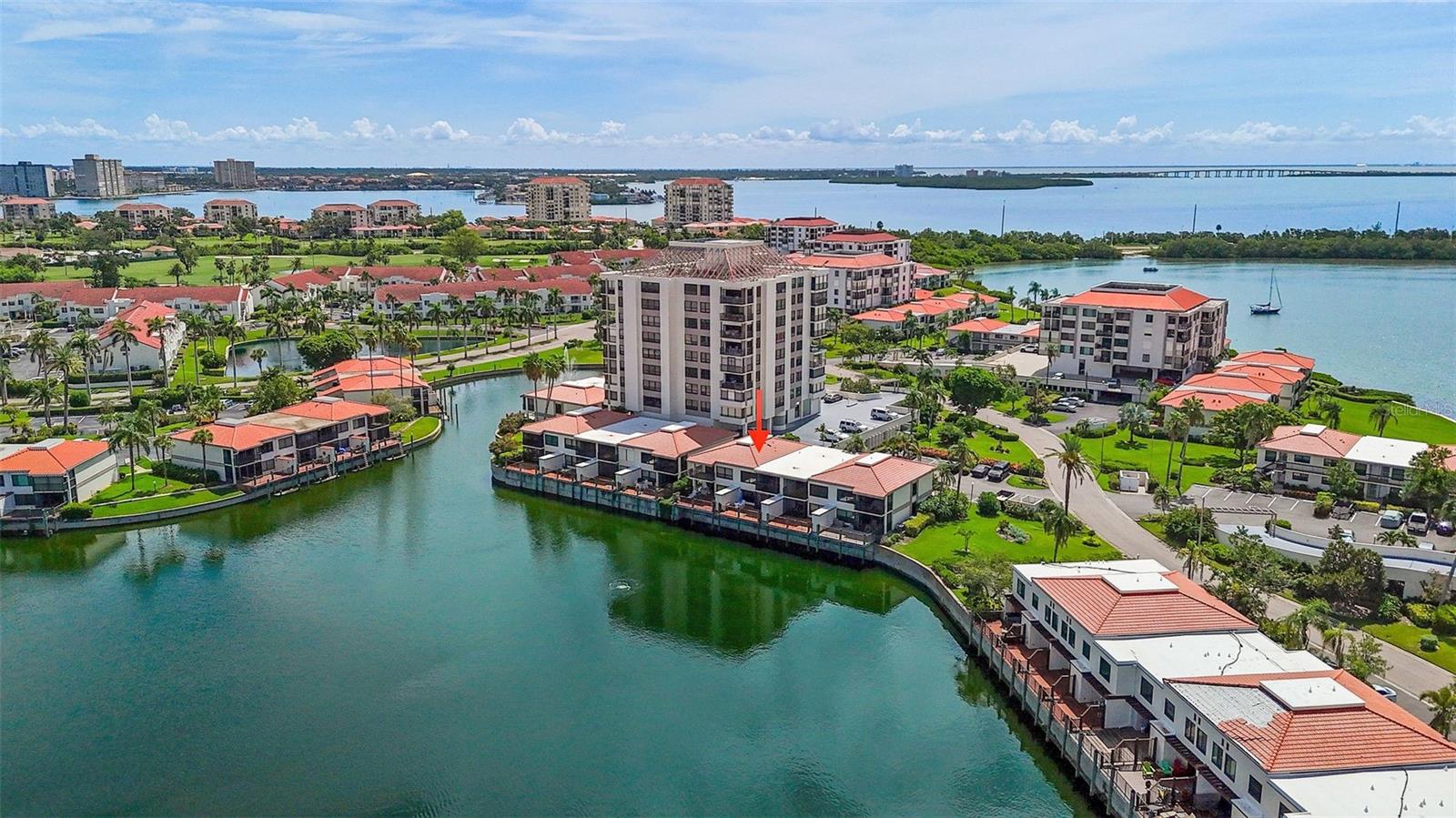 Stunning lakeside condo with an expansive patio overlooking sparkling water and a fountain! Rarely does such an exceptional property come to market at this price. Beautifully updated throughout, it features high-end finishes in every corner. Porcelain plank tile floors flow seamlessly from room to room.
The chef’s kitchen boasts Quartz counters, custom cabinets, a large breakfast bar, and stainless steel appliances. This fantastic floor plan offers both a covered and screened patio plus a large open deck—the perfect spot to relax in your lounger and watch the sunset over the water.
The light-filled primary bedroom features custom built-ins, plantation shutters, a walk-in California closet, and a serene en-suite bath. The guest bedroom is equally impressive, with a custom Murphy queen bed that allows the space to double as a home office or guest retreat.
Additional highlights include 2022 windows and sliding glass doors, hurricane shutters, an electronic screen enclosure on the patio, crown molding, a full-size washer and dryer, extra storage, and convenient parking right at your door (space #39).
Located on the island of Isla Del Sol, Bahia Del Mar “N” offers resort-style amenities including a seaside pool and spa, fitness center, and recreation room. Just minutes from award-winning Gulf beaches, Ft. DeSoto Park, and the Pinellas Bike Trail. Only 10 minutes to downtown St. Pete, 25 minutes to Tampa International Airport, and close to major sports venues for soccer, baseball, football, and hockey.
Don’t wait—start living the good life in Isla Del Sol, Island in the Sun!