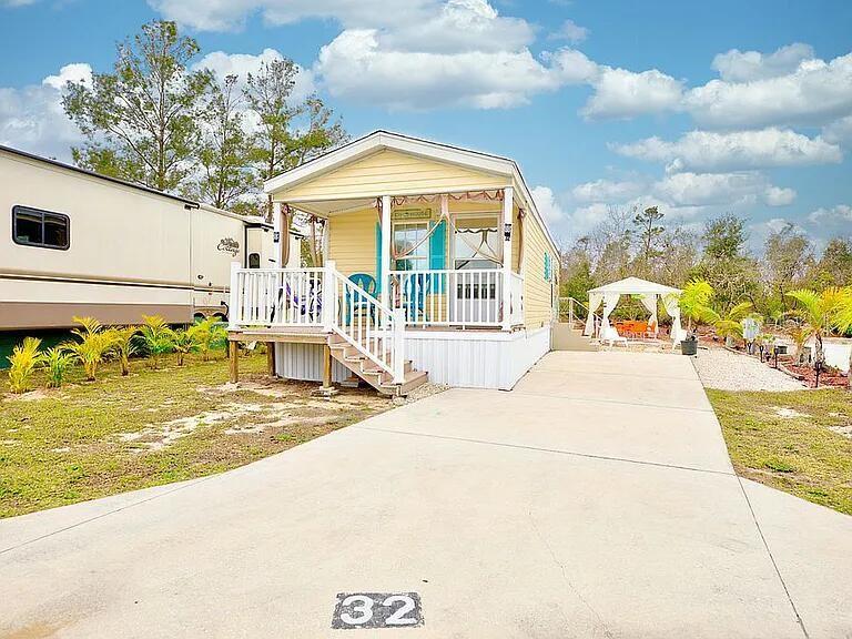 Photo of 32 Grassy Lake Circle, Lake Placid, FL 33852 (MLS # O6446048)