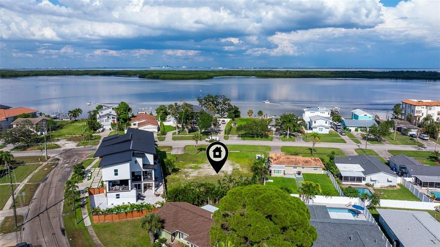 Prime Double Lot Opportunity – Bayou Grande Blvd NE. Unlock the potential of this 110 x 152 (0.36 acre) cleared double lot, perfectly situated on prestigious Bayou Grande Blvd NE. Directly across from multi-million-dollar waterfront homes, this rare oversized parcel offers endless possibilities—whether you’re envisioning a single expansive luxury residence with room for resort-style amenities, or exploring the potential to subdivide for two new builds. Positioned at the gateway to Northeast St. Petersburg, between Venetian Isles and Bayou Grande, this property provides the ideal blend of prestige and convenience. Enjoy sidewalks, street lighting, and established neighborhood surroundings—all while being just minutes from waterfront parks, boat ramps, golf and tennis, top-rated schools, boutique shopping, dining, and vibrant downtown St. Pete. Utilities are ready with public sewer, water, and electricity already in place, making the path to construction seamless. The flat, buildable site offers a blank canvas for your architect and builder to create something truly spectacular. Opportunities like this are exceedingly rare—especially with this level of lot size, location, and surrounding home values. Whether you’re a builder, investor, or homeowner dreaming of your forever estate, this property represents a can’t-miss chance to design and build in one of the most desirable pockets of St. Petersburg. 6046 Bayou Grande Blvd NE—where vision meets value. Don’t wait to secure your slice of St. Pete luxury living.