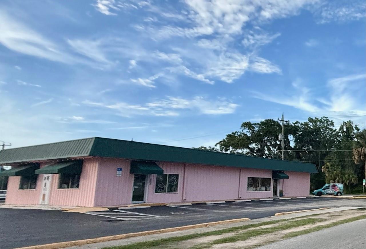 Prime commercial property located in historic New Smyrna Beach, just blocks from Canal Street and the North Causeway. Located on the corner of Mary and Orange, with over 100 feet of direct footage on US1. There are endless possibilities with this Mixed-Use property on over 0.25 acres, offering flexibility, and a current lease with a coffee shop provides excellent income potential. Can be used as three separate units or opened up and used as one, with over 3,200 square feet total. New a/c and paint in 2020. Plenty of parking is available, and the location is close to shopping and restaurants.