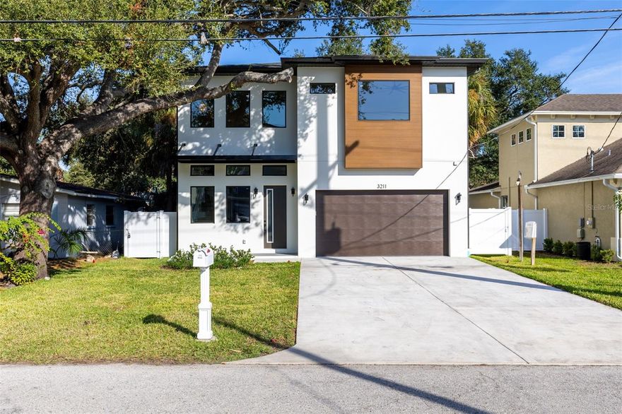 Welcome to this stunning NEW construction home offering the best of South Tampa living in a NO FLOOD ZONE. Featuring 4 bedrooms, 4.5 bathrooms, and 3056 sqft of living space, this home is thoughtfully designed to deliver modern style & everyday comfort. From the moment you enter, you’re greeted by soaring ceilings and an abundance of natural light, highlighting the impressive two-story living area and statement staircase. The open-concept first floor seamlessly connects the living, dining, and kitchen spaces, perfect for both everyday living and entertaining. The chef-inspired kitchen features stainless steel appliances, custom cabinetry, quartz countertops, and an exceptional butler’s pantry with its own refrigerator. Yes, two refrigerators for ultimate convenience! The FIRST FLOOR PRIMARY suite is a true retreat with two walk-in closets and a spa-like ensuite featuring double vanities, a walk-in shower, and a soaking tub. Upstairs, an oversized loft filled with natural light offers the ideal flex space for a media room, office, or lounge. You’ll also find three generously sized bedrooms, including two with ensuite bathrooms, plus an additional full bath. The laundry room is equally well-appointed with custom cabinetry, a sink, and ample storage and workspace. Step outside to the covered lanai with a built-in grill and hood area, perfect for enjoying Florida’s year-round outdoor lifestyle. The massive, fully fenced backyard provides plenty of space for entertaining, play, storage, or future enhancements. Additional highlights include a 2-car garage and a driveway that can accommodate up to four vehicles. Ideally located just minutes from Bayshore Blvd, about 10 minutes to Downtown Tampa, and under 25 minutes to Downtown St. Pete, you’ll be close to top dining, shopping, and local attractions. Don’t miss the opportunity to see this exceptional home, schedule your private showing today!