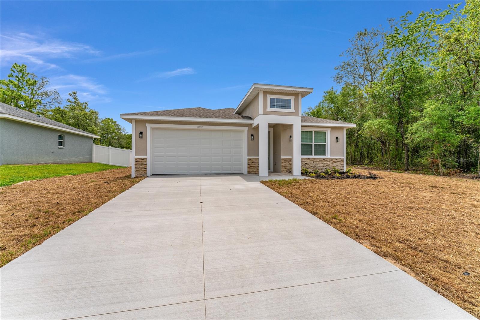 Beautiful New Construction 4 Bed, 3 Bath Single-Family Home Near The Villages. No HOA! Welcome to your
home! This single-family residence offers 2,057 sq ft of modern living space with an ideal open-concept layout,
perfect for both relaxing and entertaining. Featuring two spacious primary suites, this home provides
exceptional flexibility for multigenerational living or guest accommodations. The split-bedroom floor plan
ensures privacy and comfort for all. You'll love the high ceilings, ceramic tile flooring throughout, and stylish
granite countertops that elevate the look and feel of the home. The kitchen seamlessly connects to the dining and
living areas, creating a welcoming and open space. Conveniently located near shopping, medical facilities, and
just minutes from The Villages, you'll enjoy the perfect balance of peaceful living with easy access to everyday
essentials. No HOA! Bring your boat, RV, or toys, this home gives you the freedom you deserve. Don't miss out
on this rare new construction opportunity in a prime location!